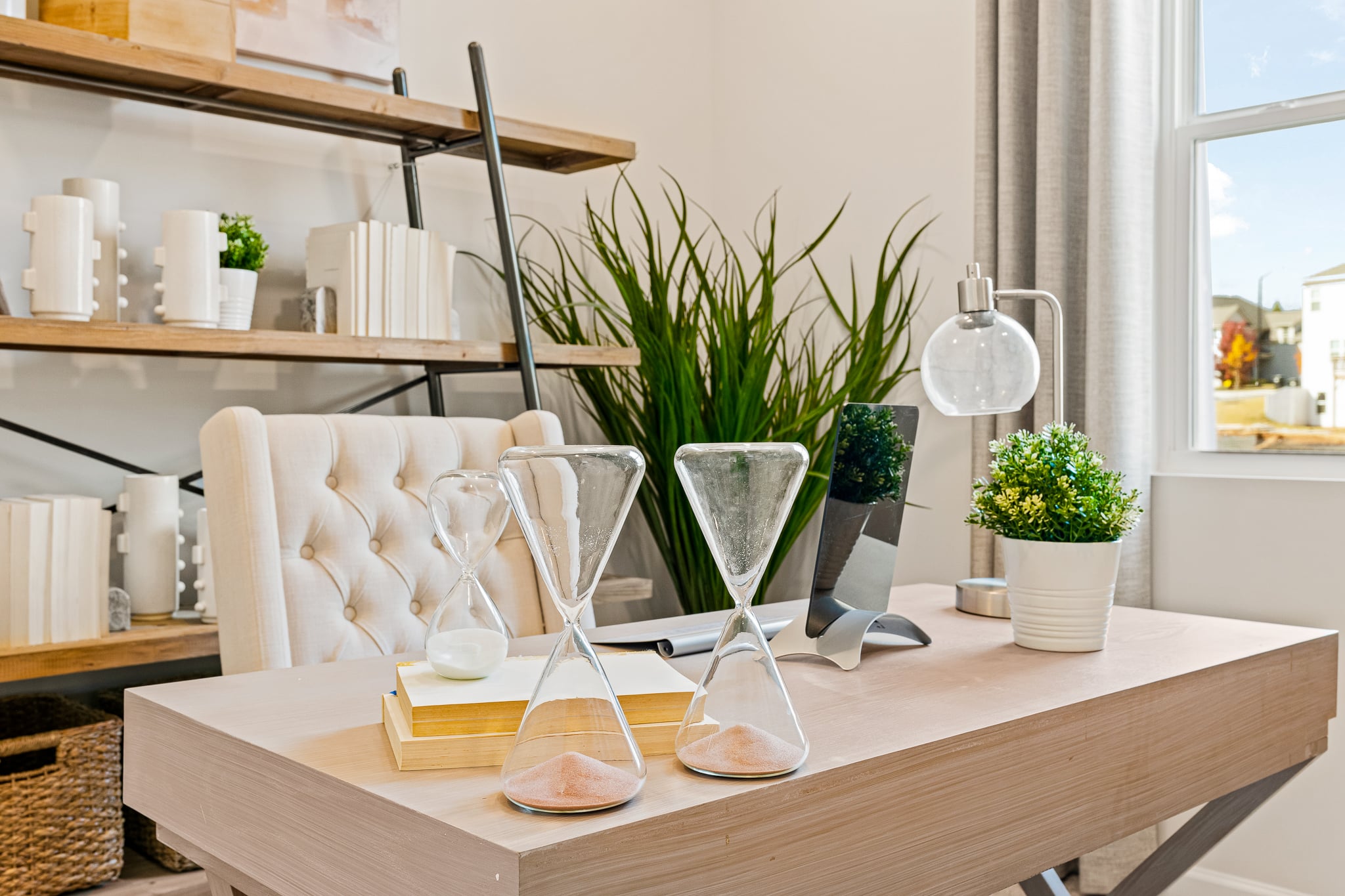 A table with a vase and chairs.