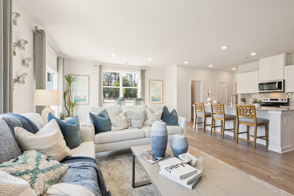 A living room with a wood floor.
