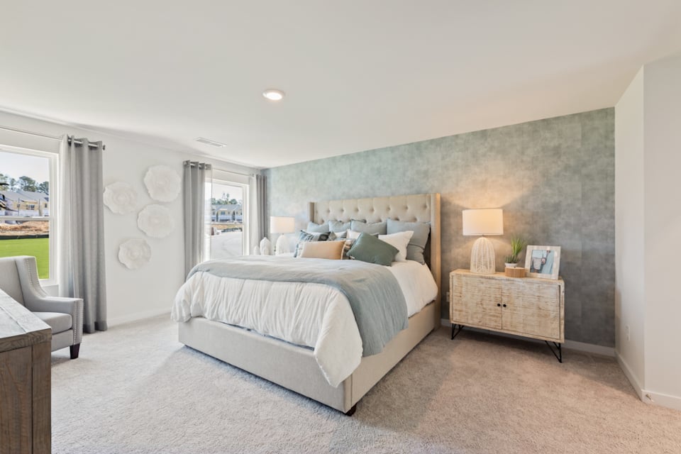 A bedroom with a large bed.