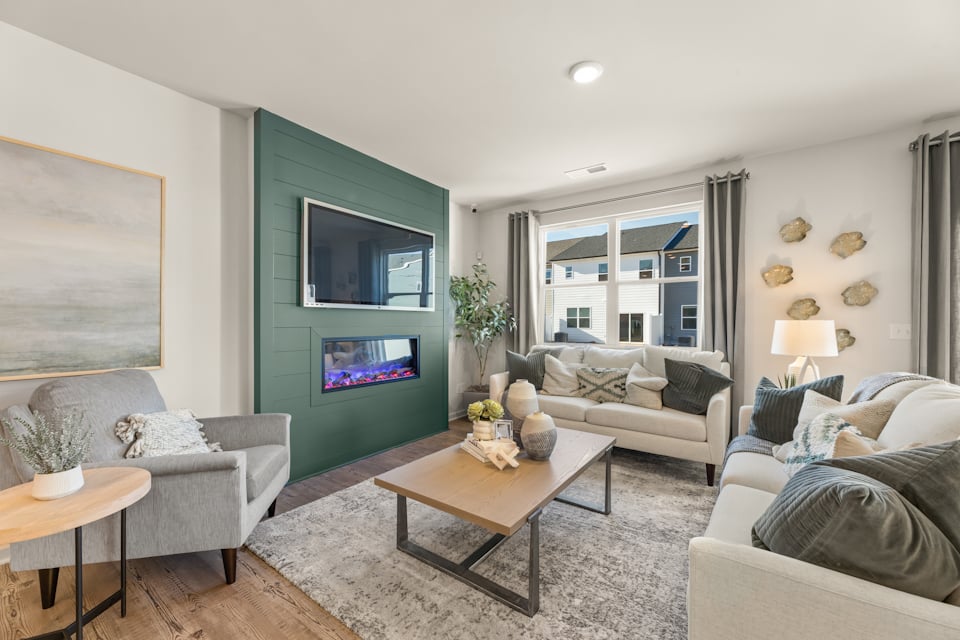 A living room with a couch and a table.