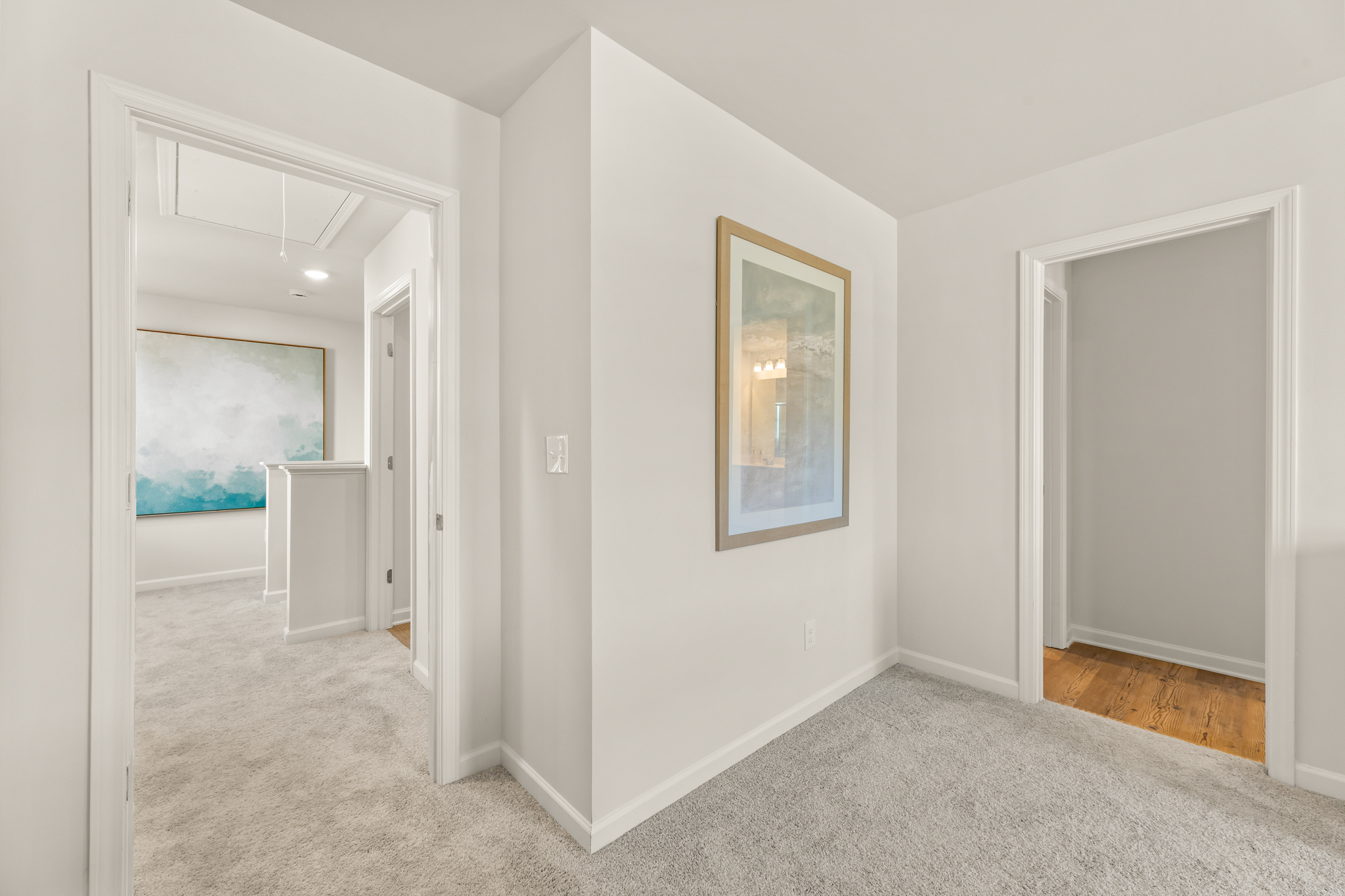 A hallway with white walls.