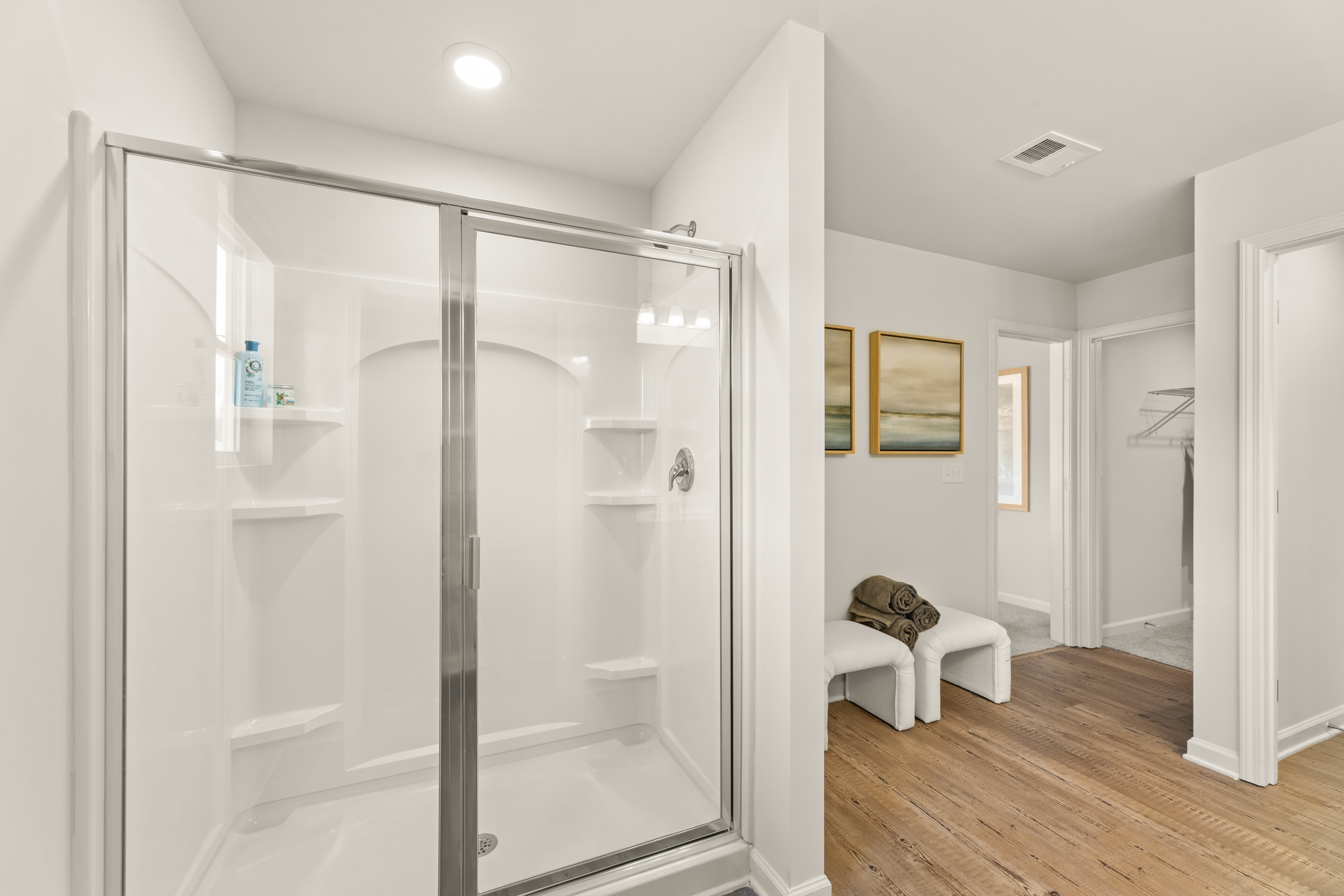 A bathroom with a glass shower.