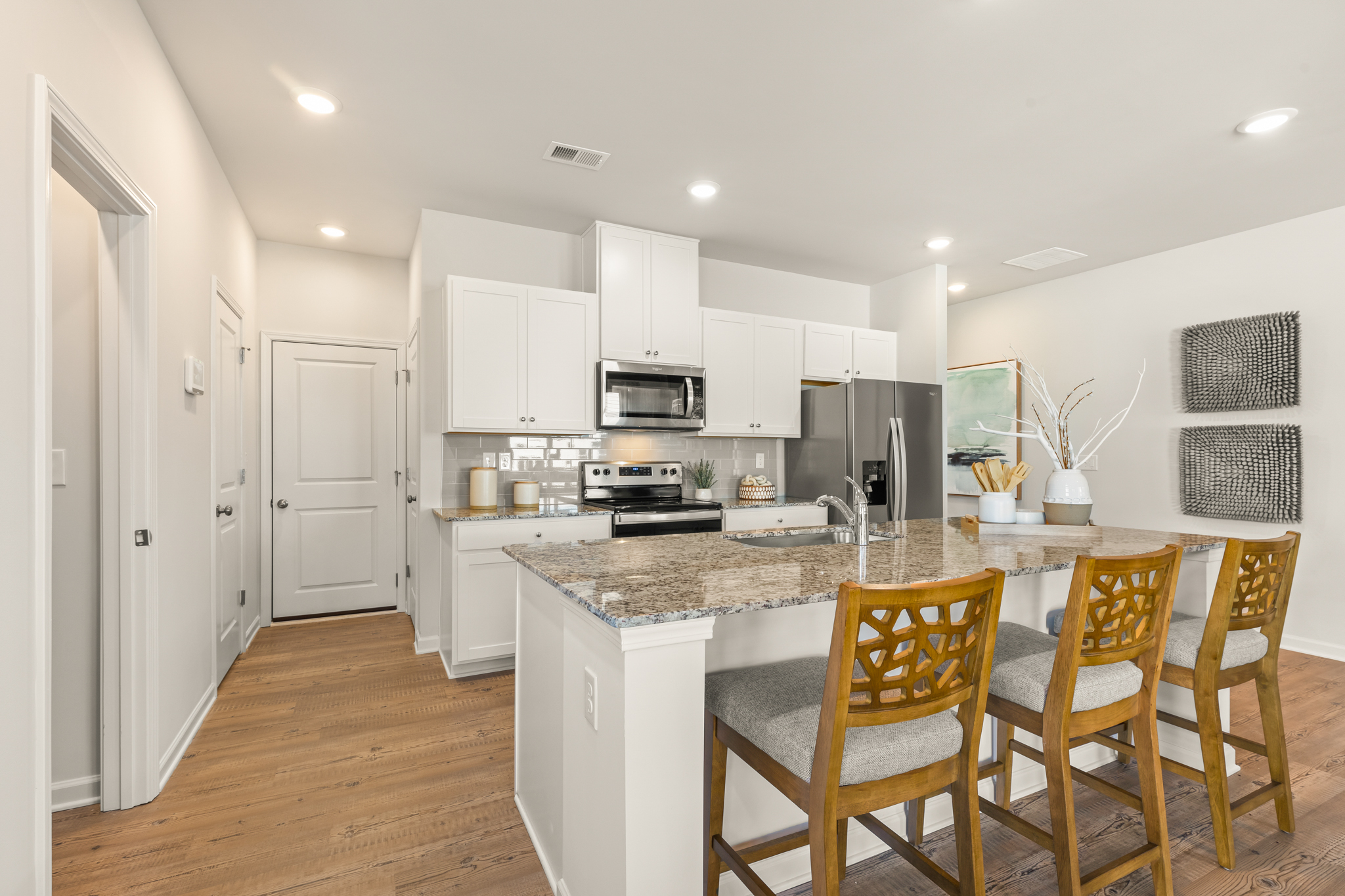A kitchen with a dining table.