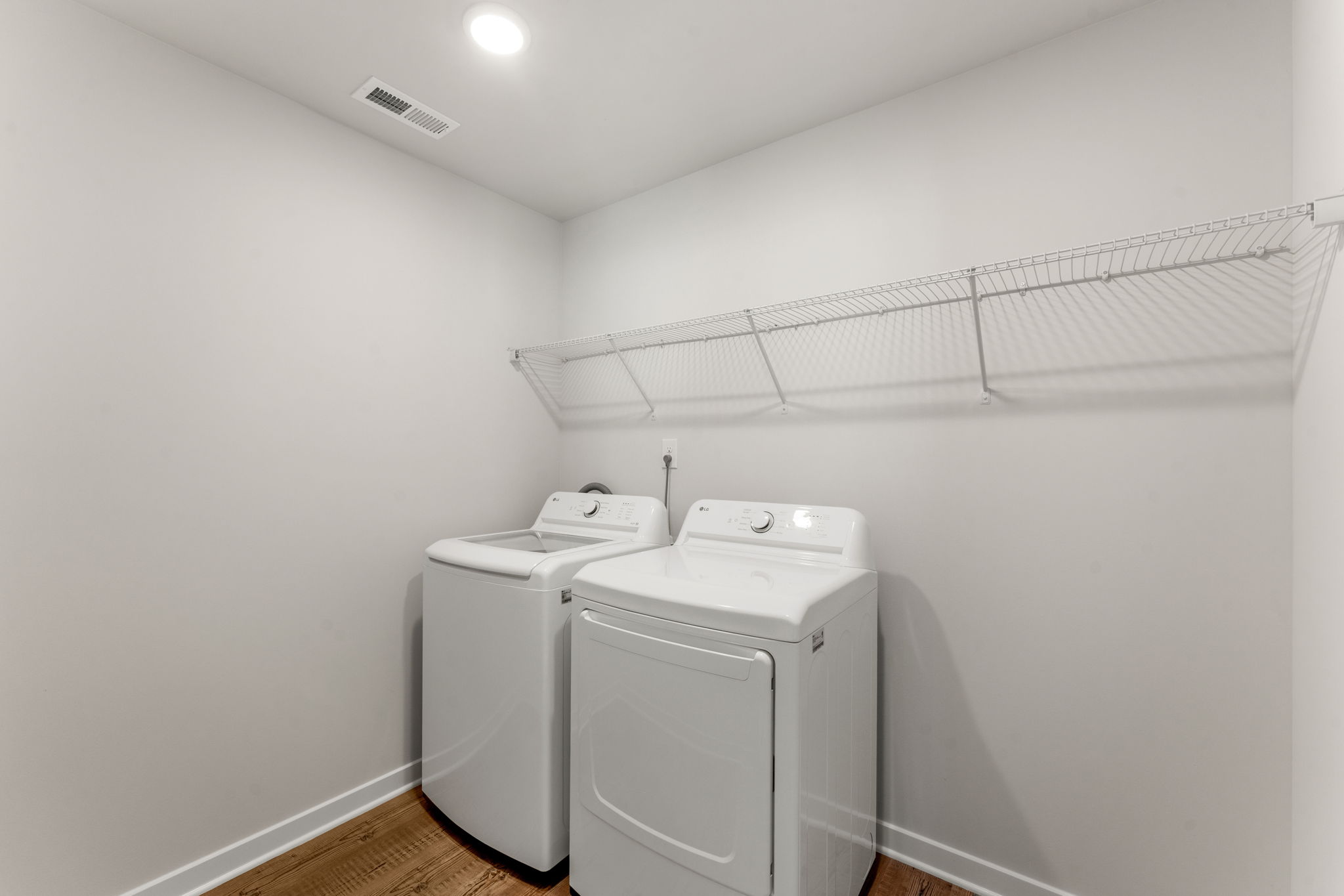 A washing machine in a room.