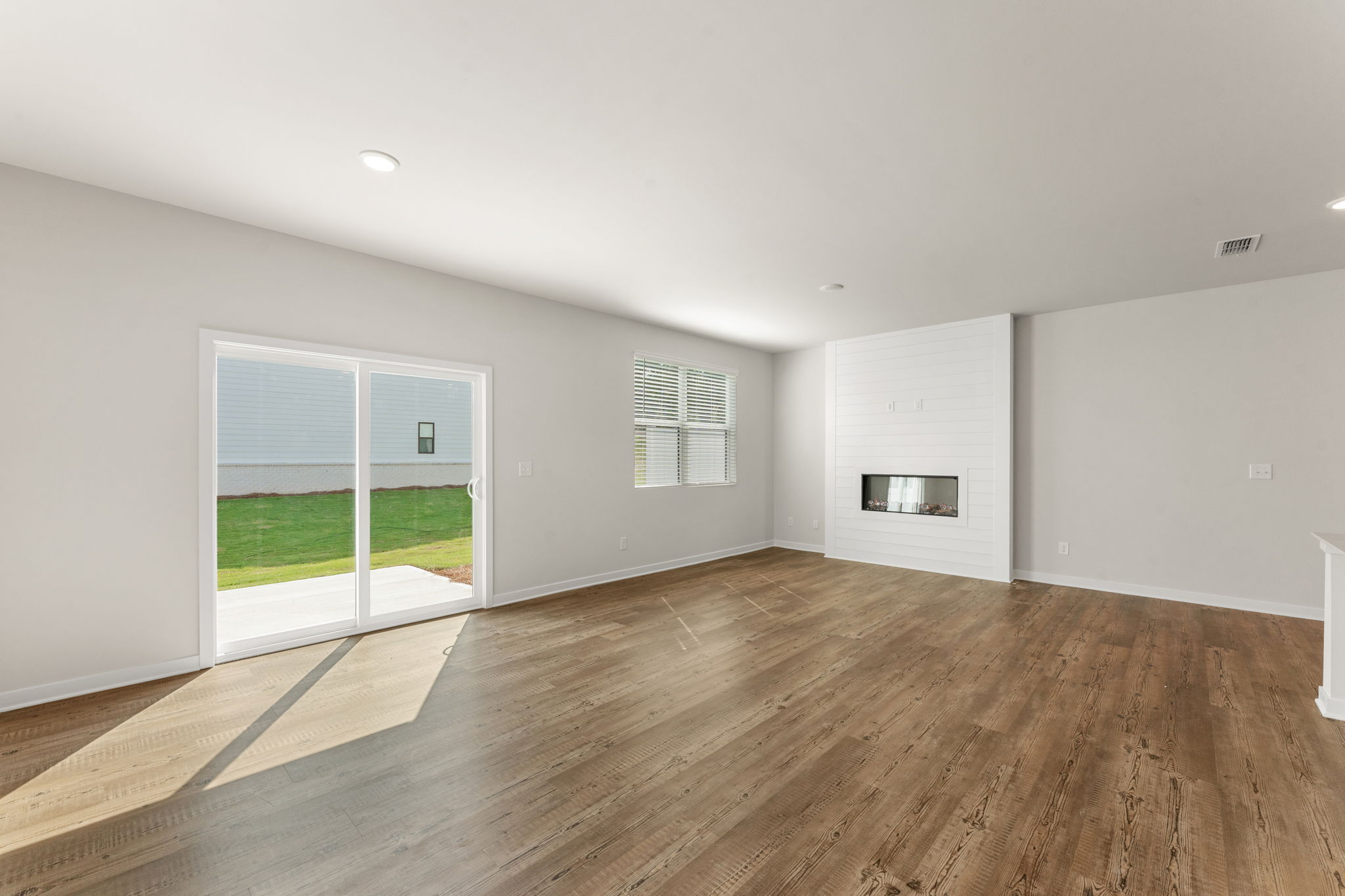 A room with a wood floor and a wood floor.