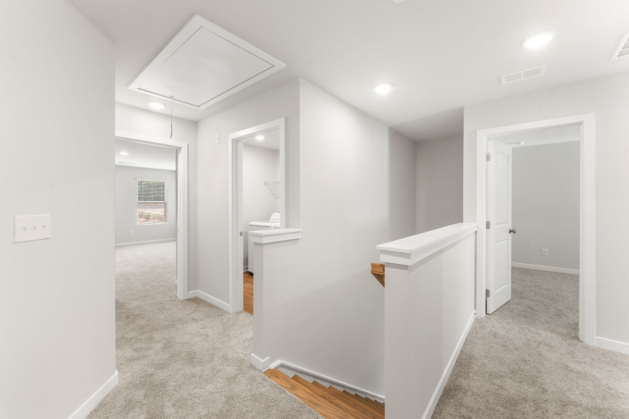A bathroom with a sink and a shower unit.