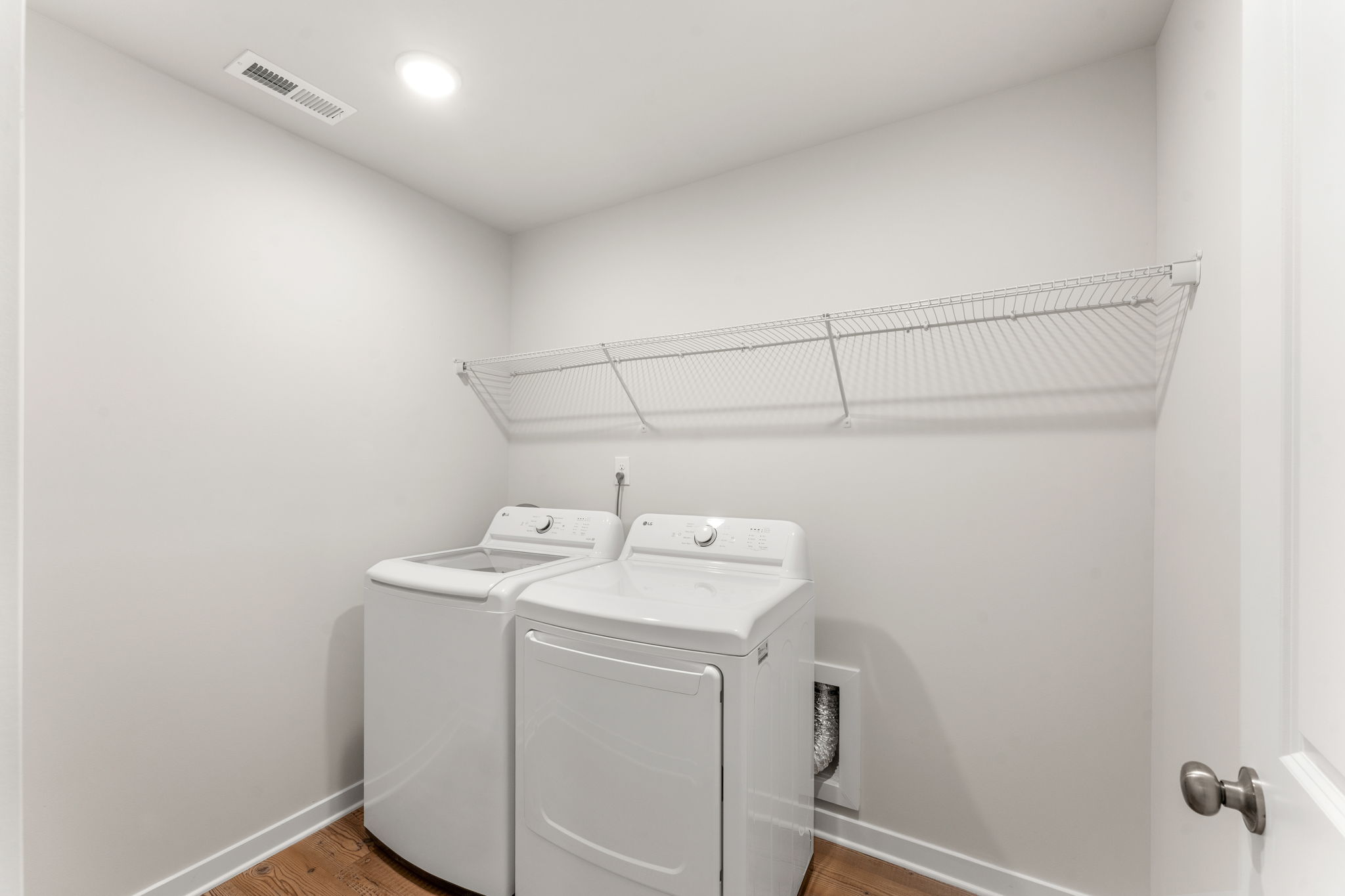 A white washer and dryer in a room.