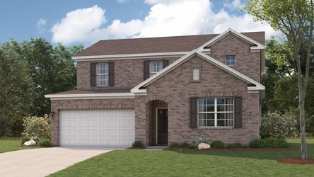 A brick house with a garage.