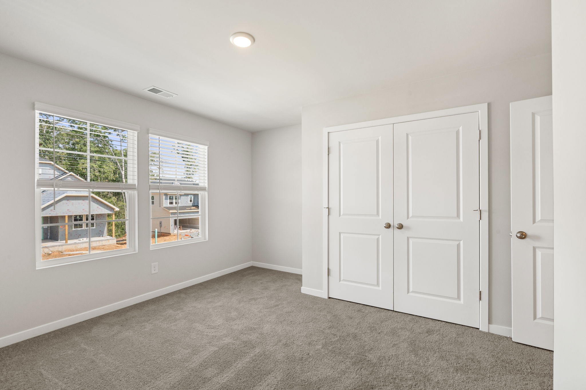 A room with white doors and windows.