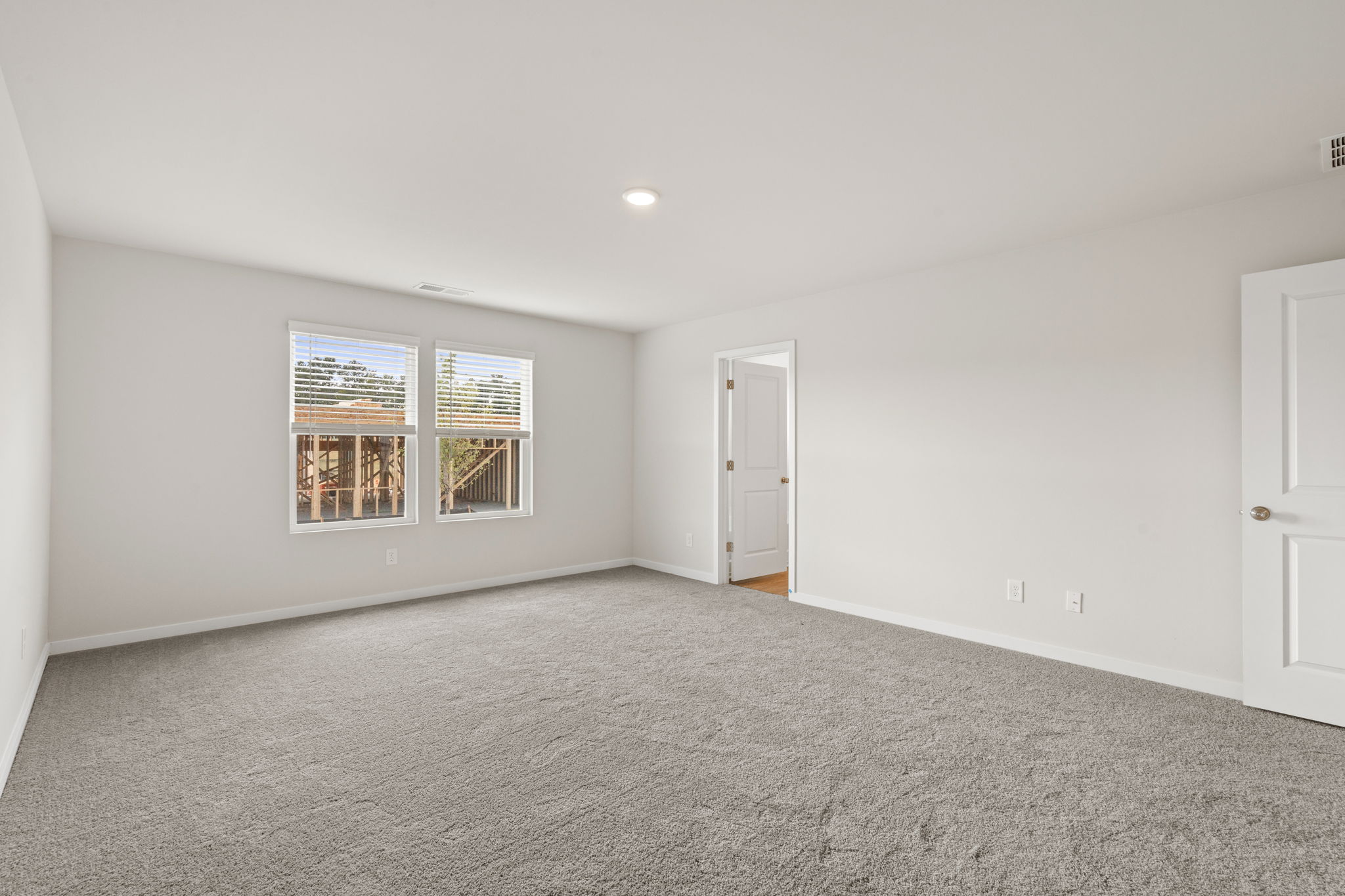 A room with a door and windows.