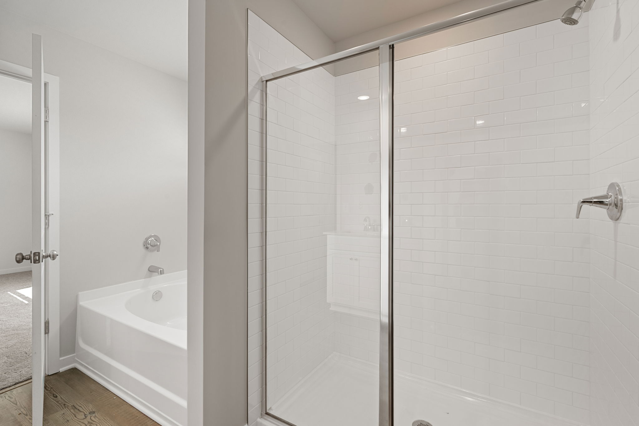 A bathroom with a glass shower.