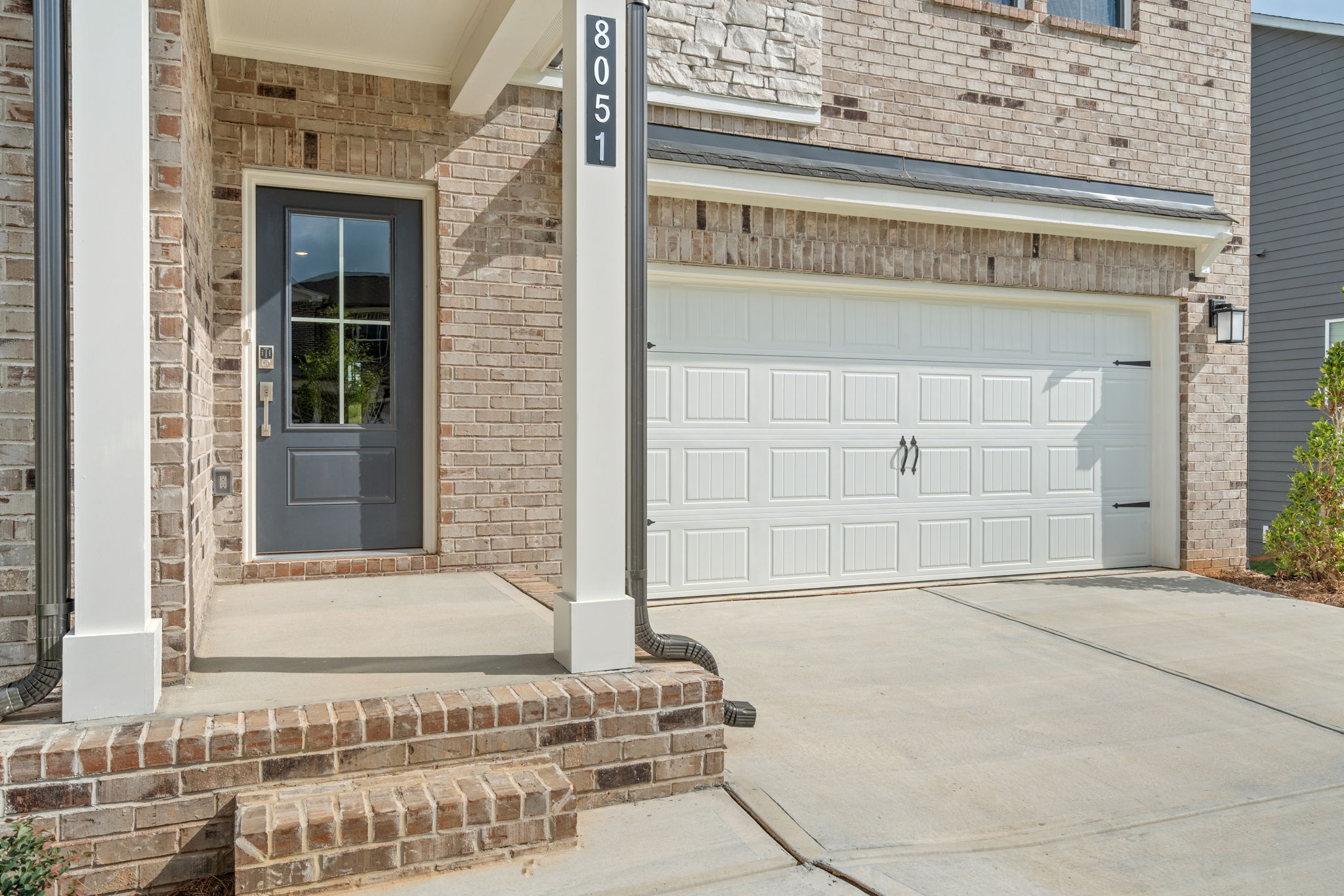 A building with a garage door.