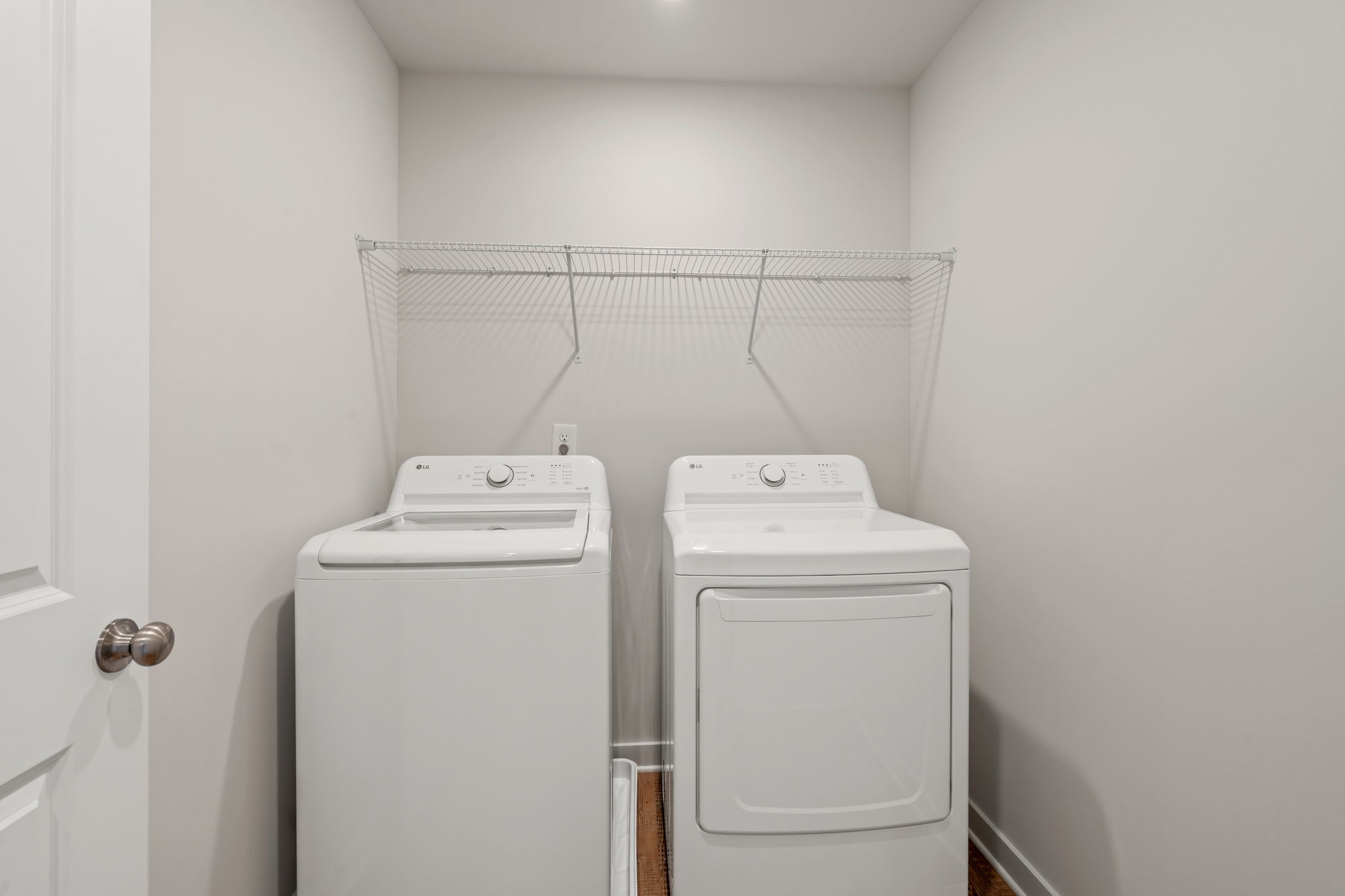 A washing machine in a room.
