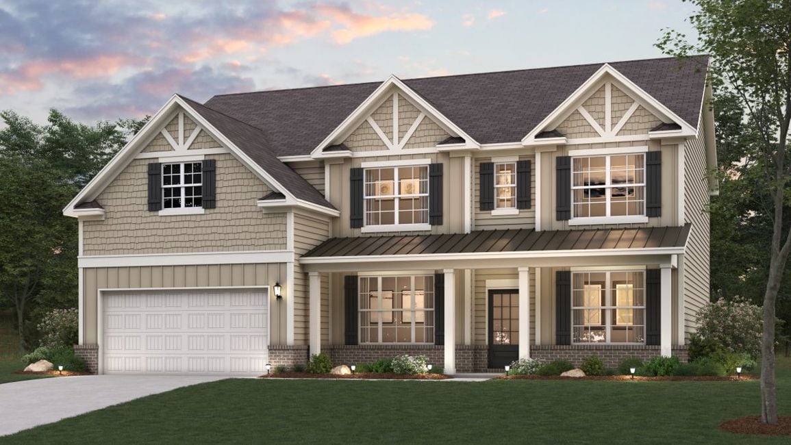 A house with a lawn in front.