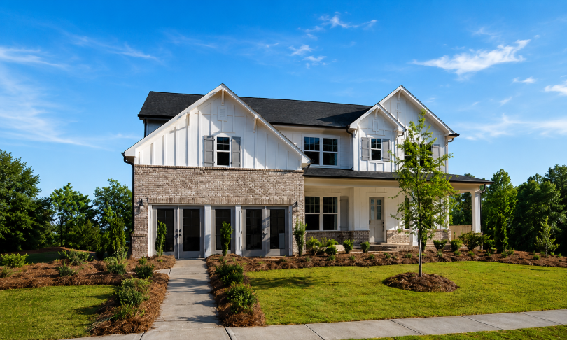 A large house with a driveway.