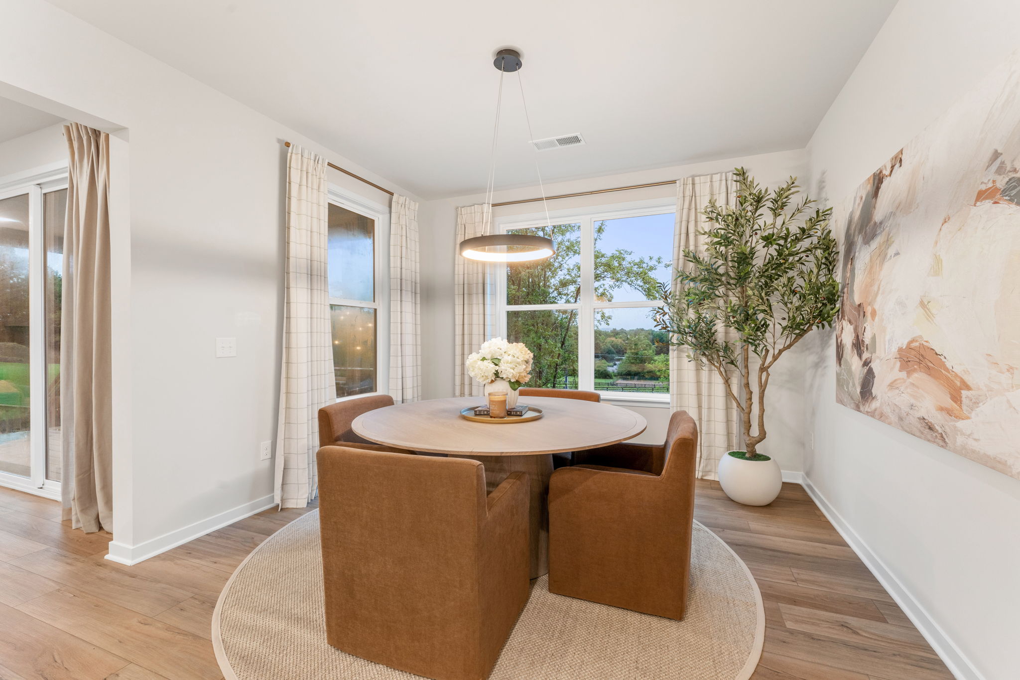 A room with a table and chairs.