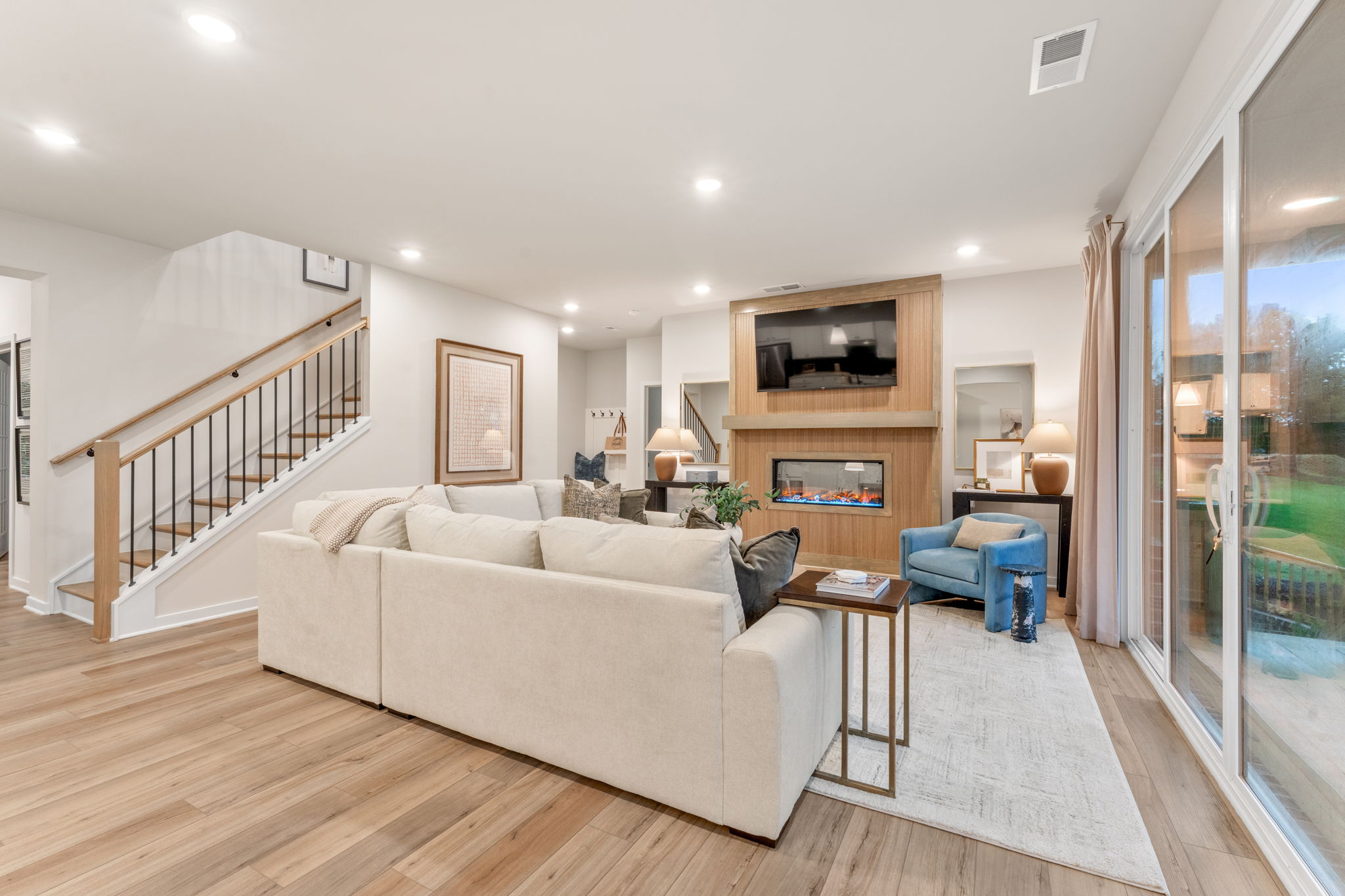 A living room with a large glass door.