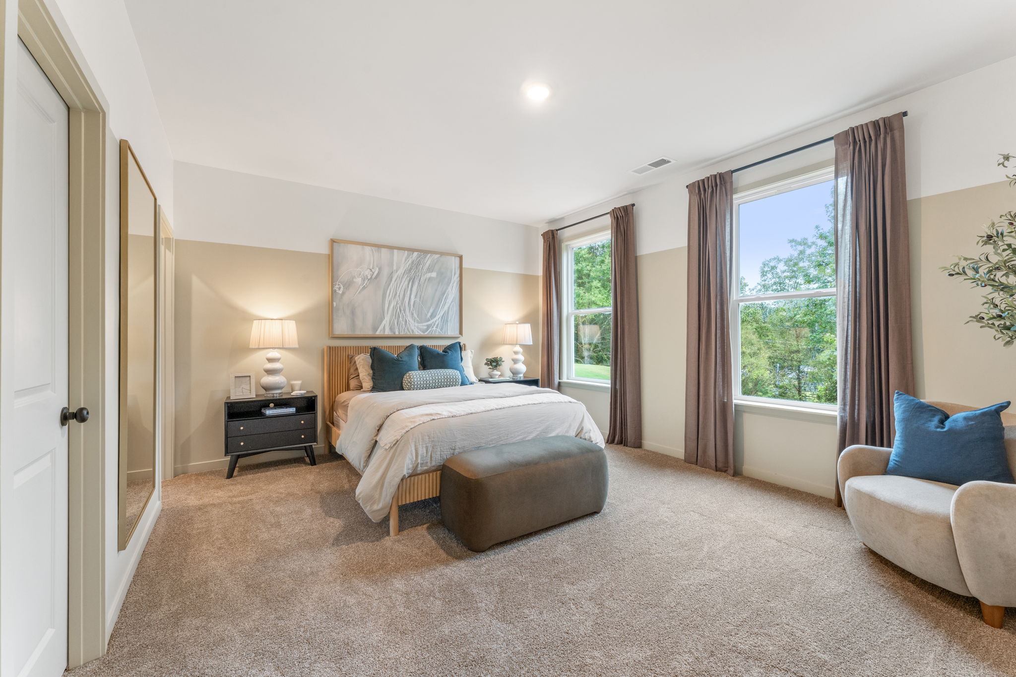 A bedroom with a large bed.