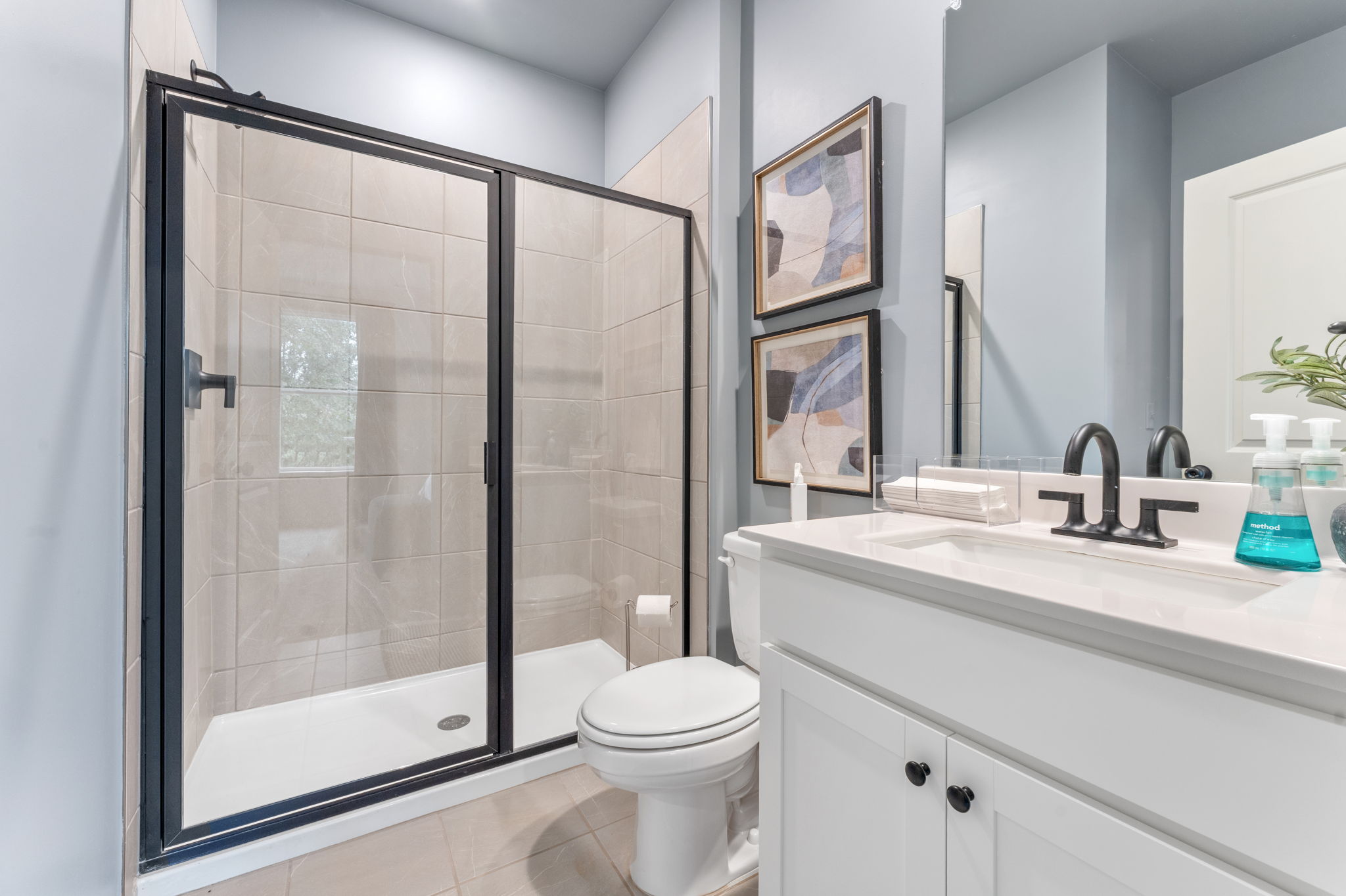A bathroom with a glass shower.