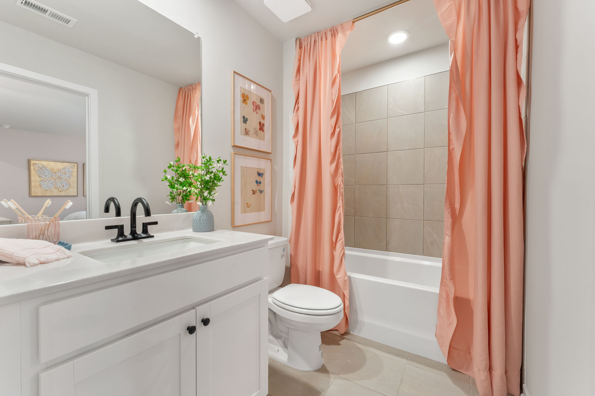 A bathroom with a red curtain.