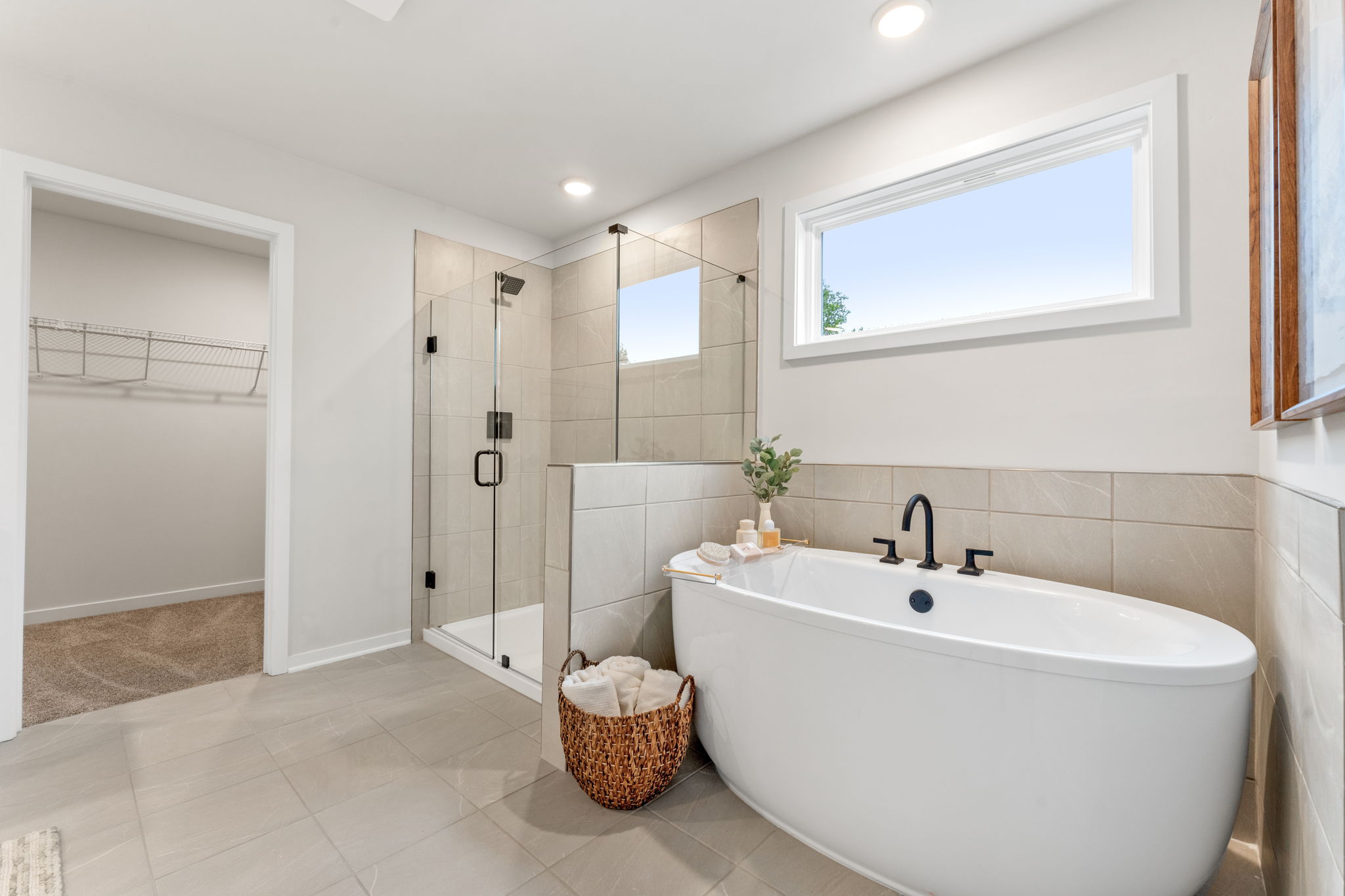 A bathroom with a tub and shower.