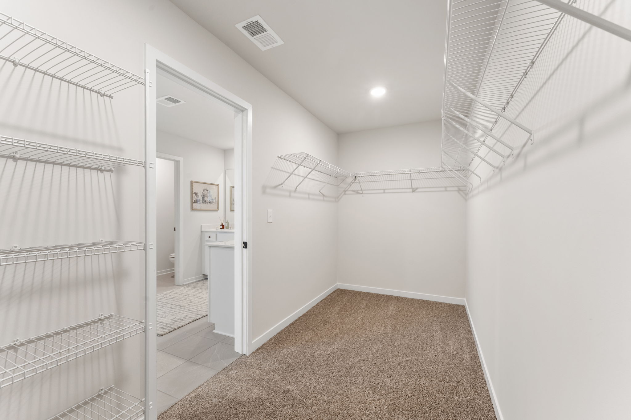 A hallway with white walls.