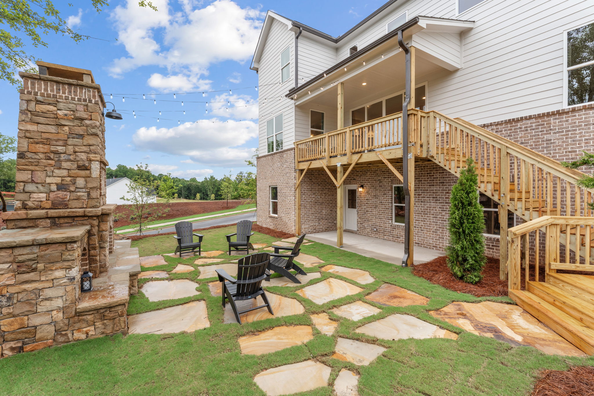 A house with a patio and chairs.