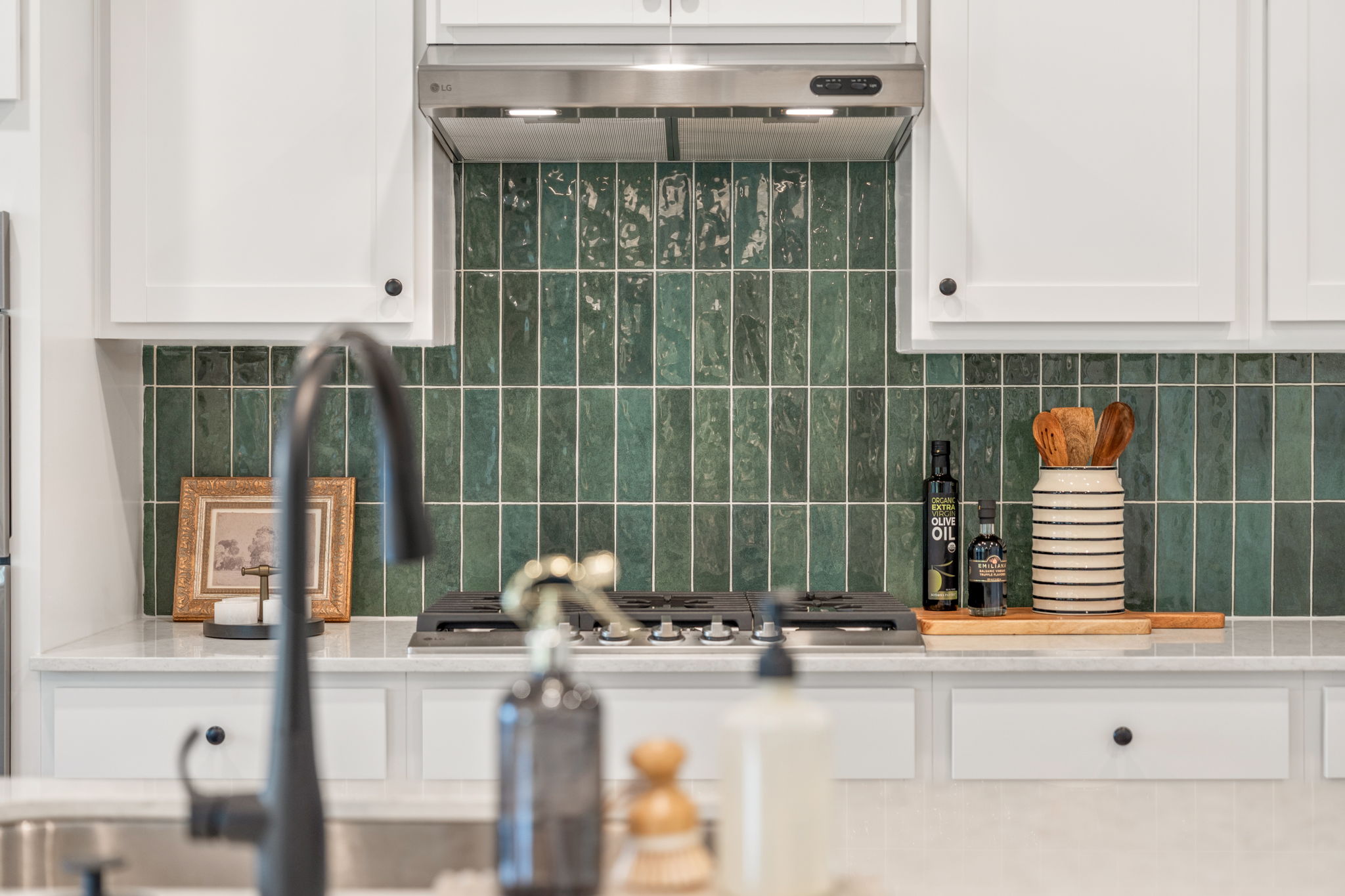 A kitchen with a sink and a faucet.
