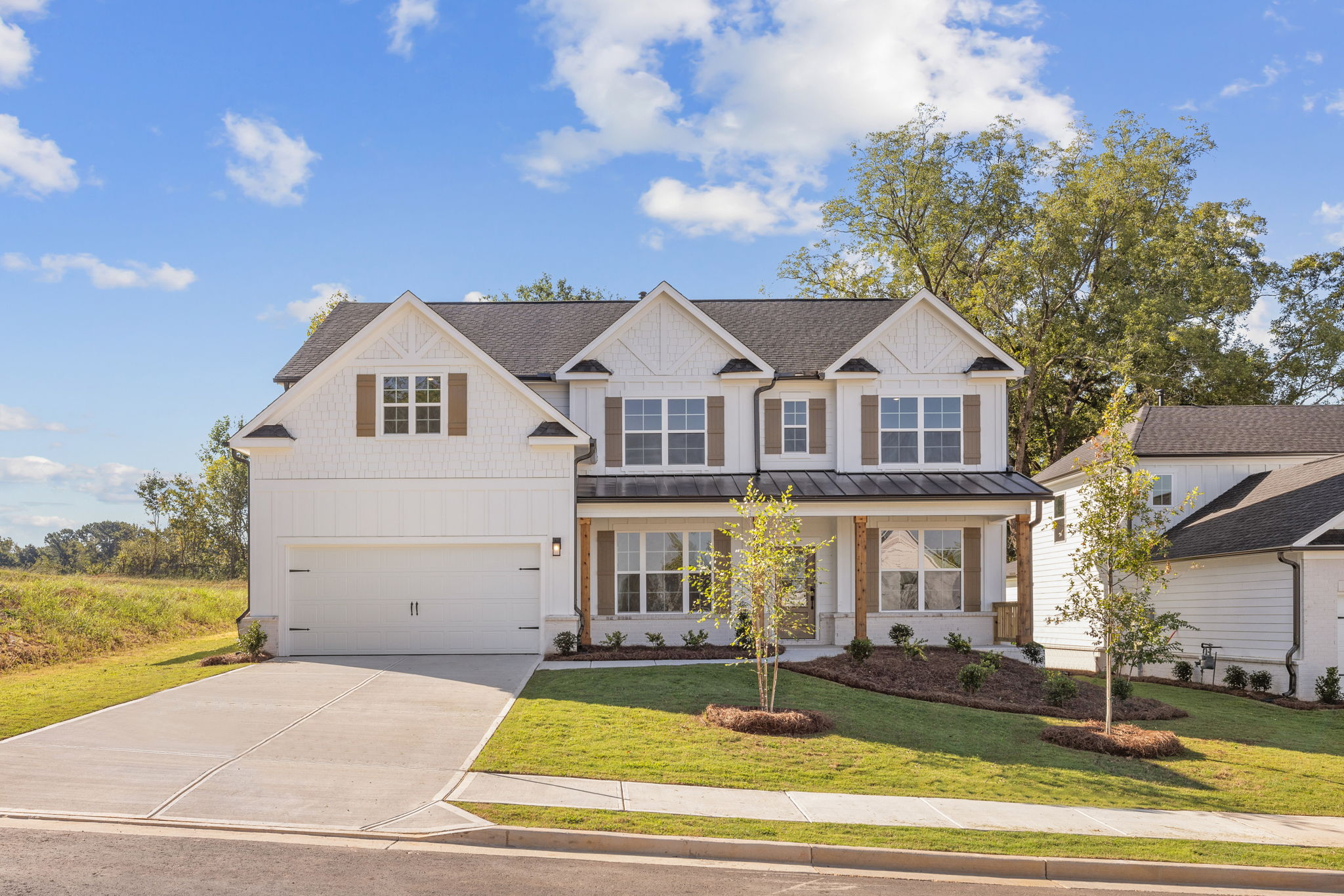A large house with a driveway.