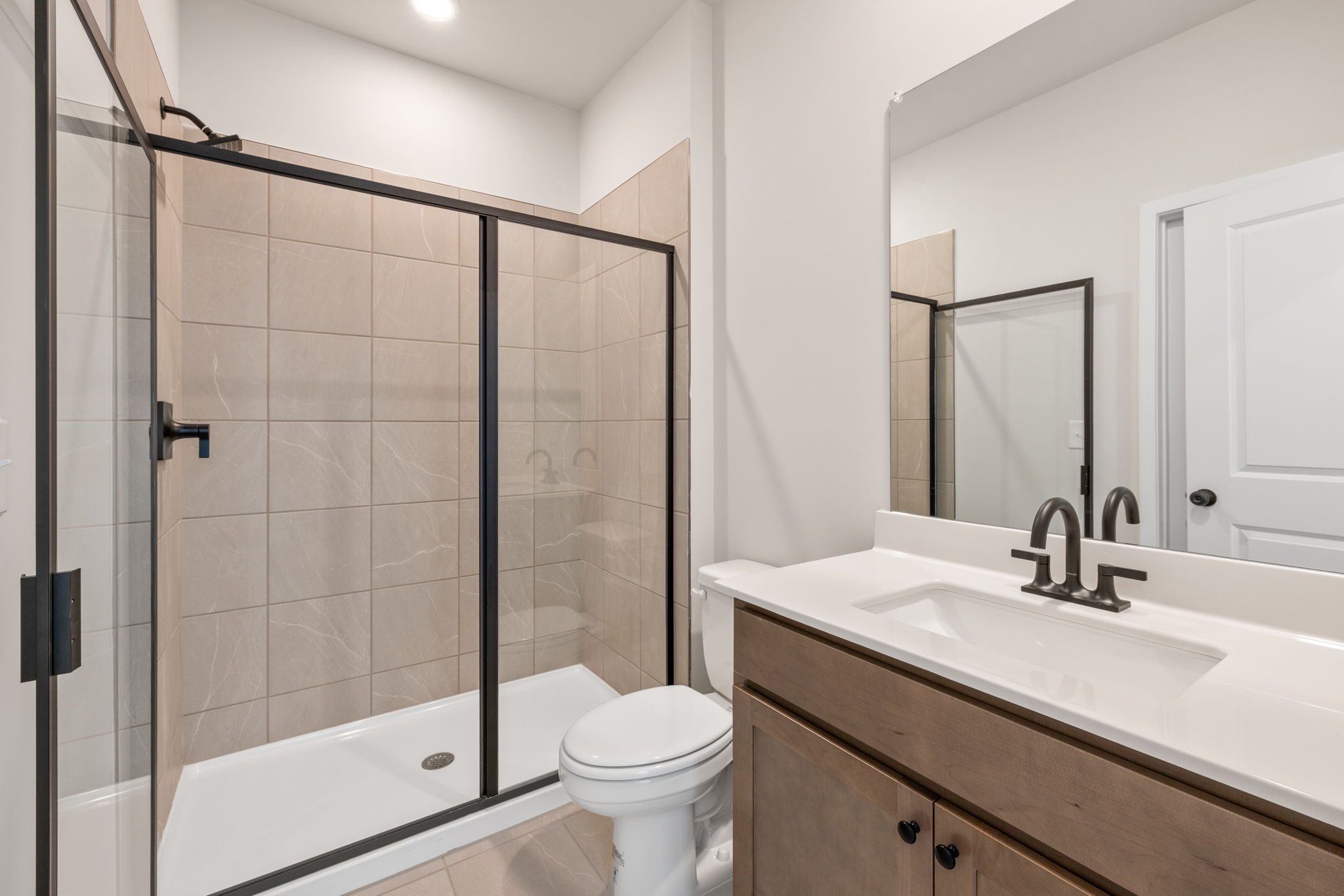 A bathroom with a glass shower.