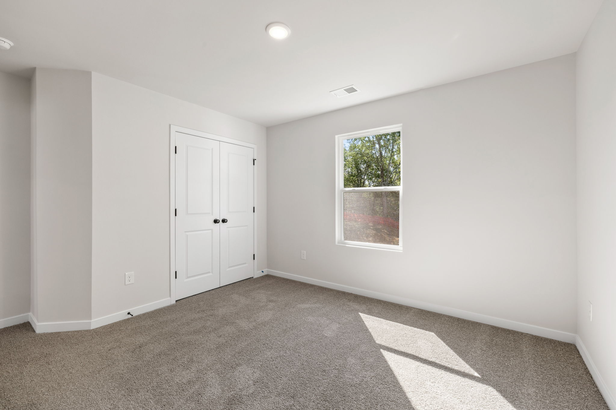 A room with white doors.