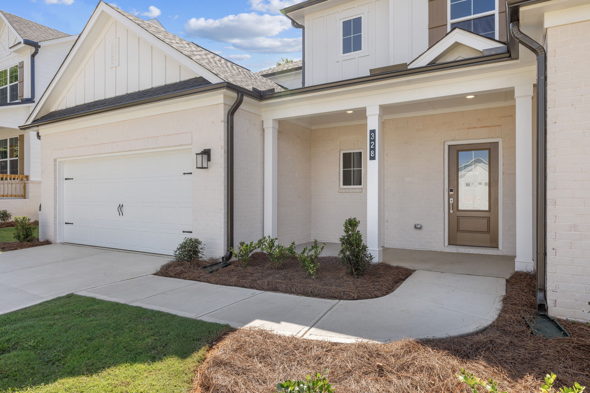A house with garages and a driveway.
