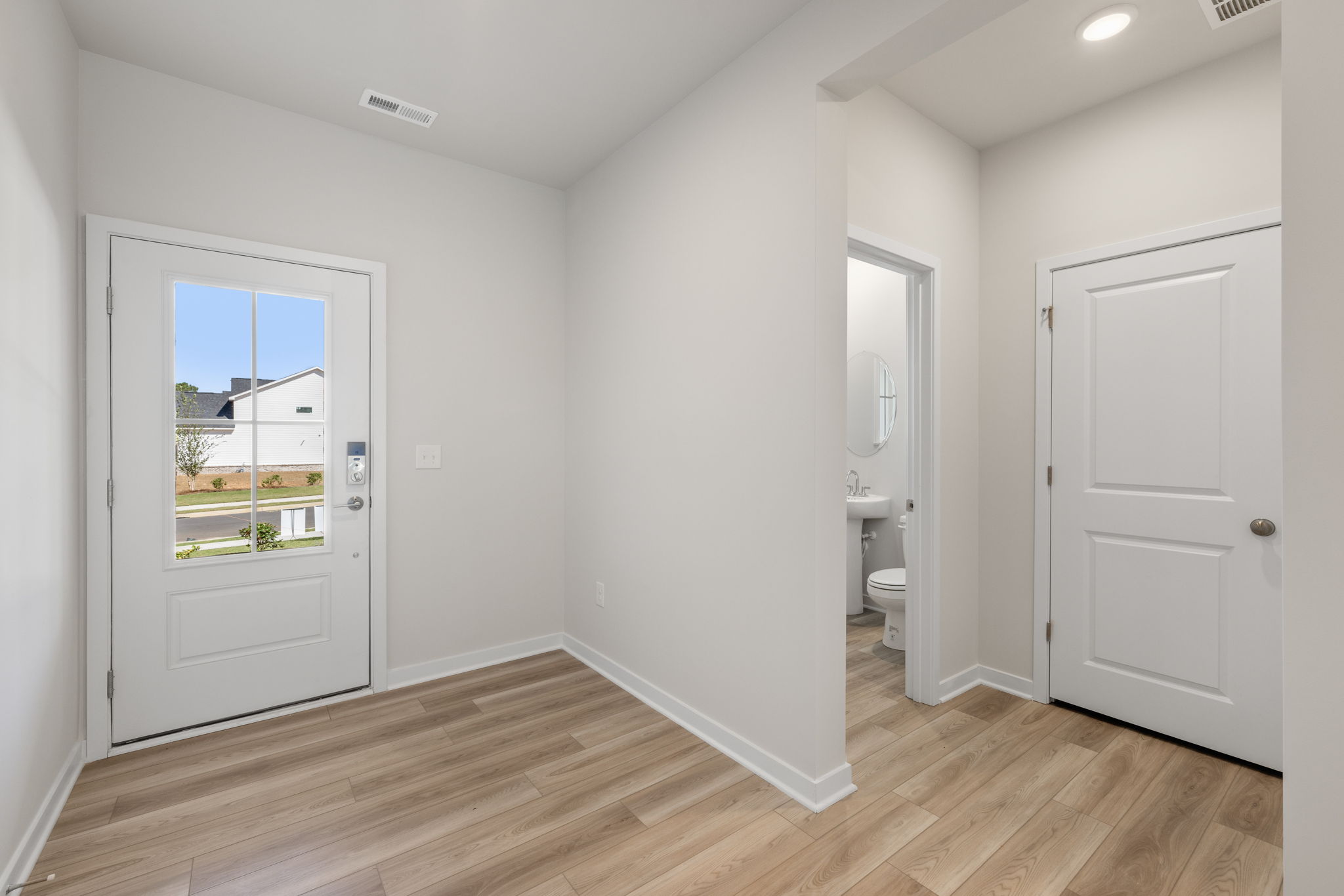 A bathroom with a wood floor.