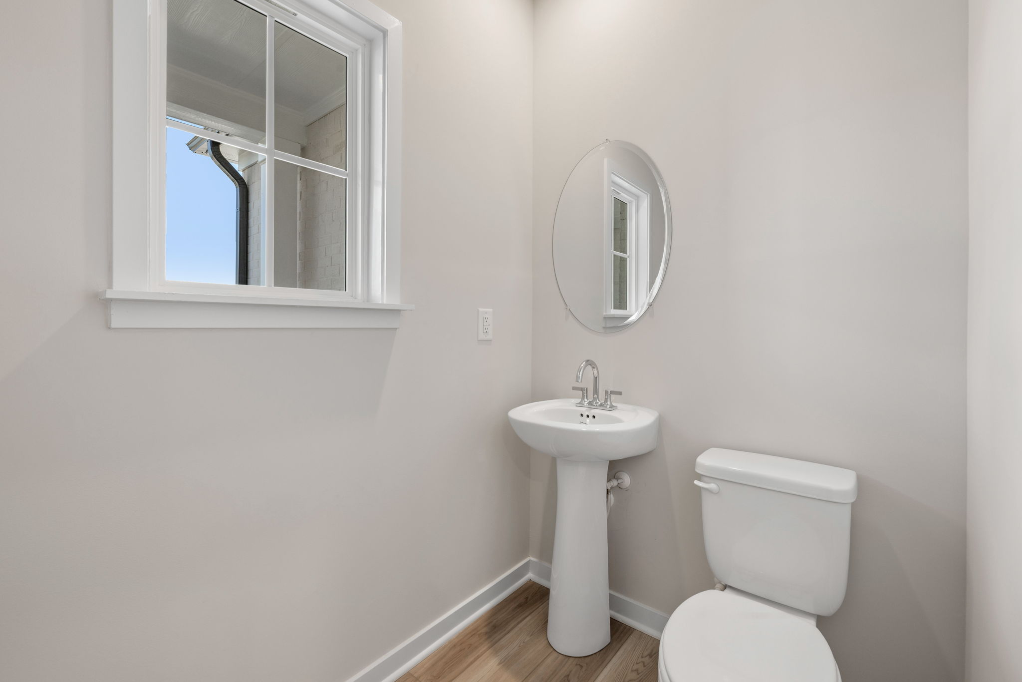 A bathroom with a sink and toilet.