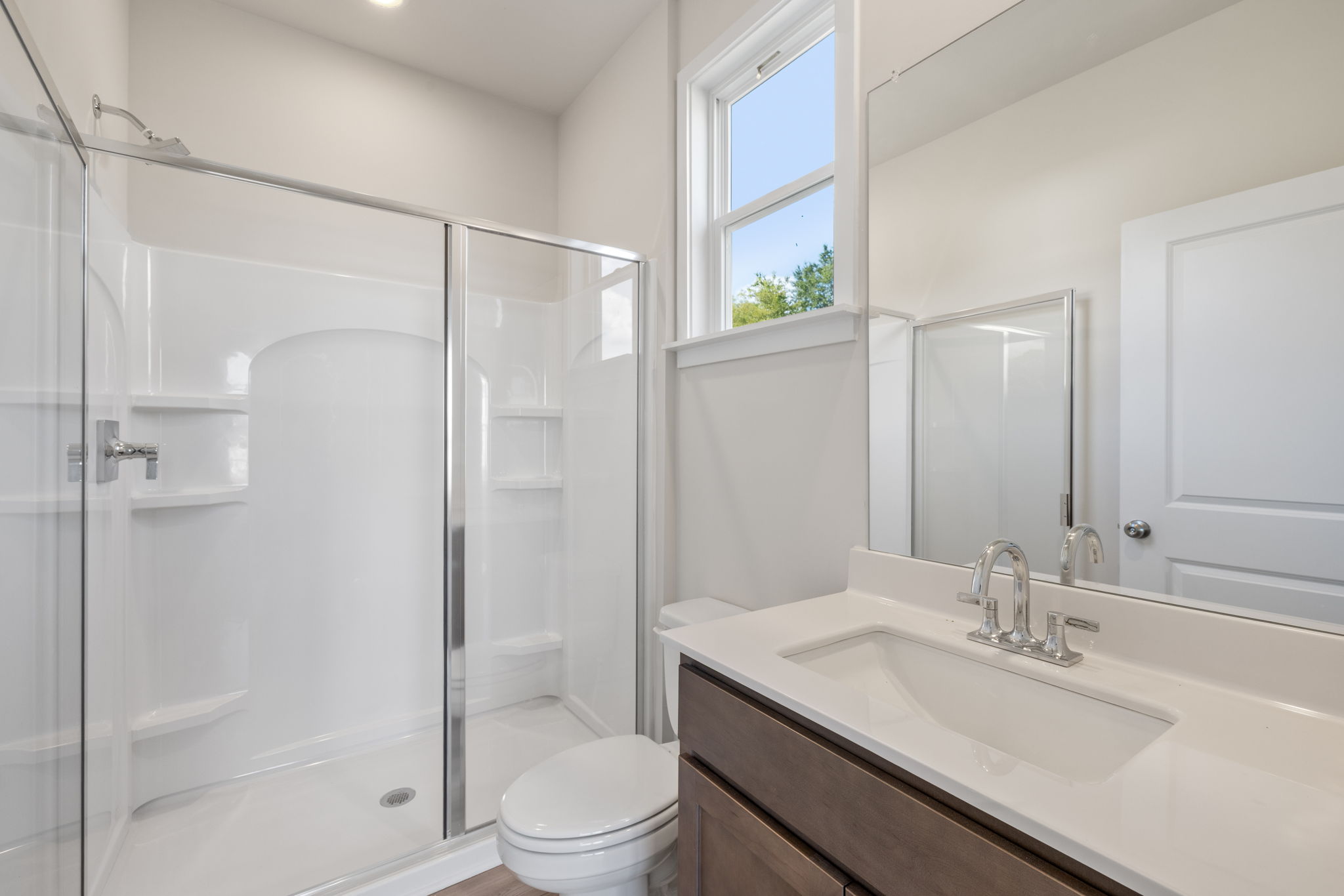 A bathroom with a glass shower.