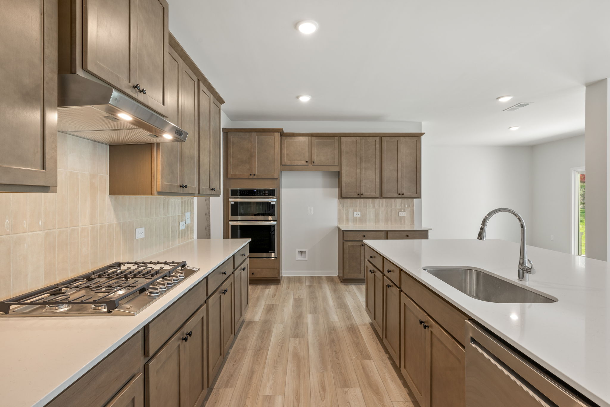 A kitchen with wooden cabinets.
