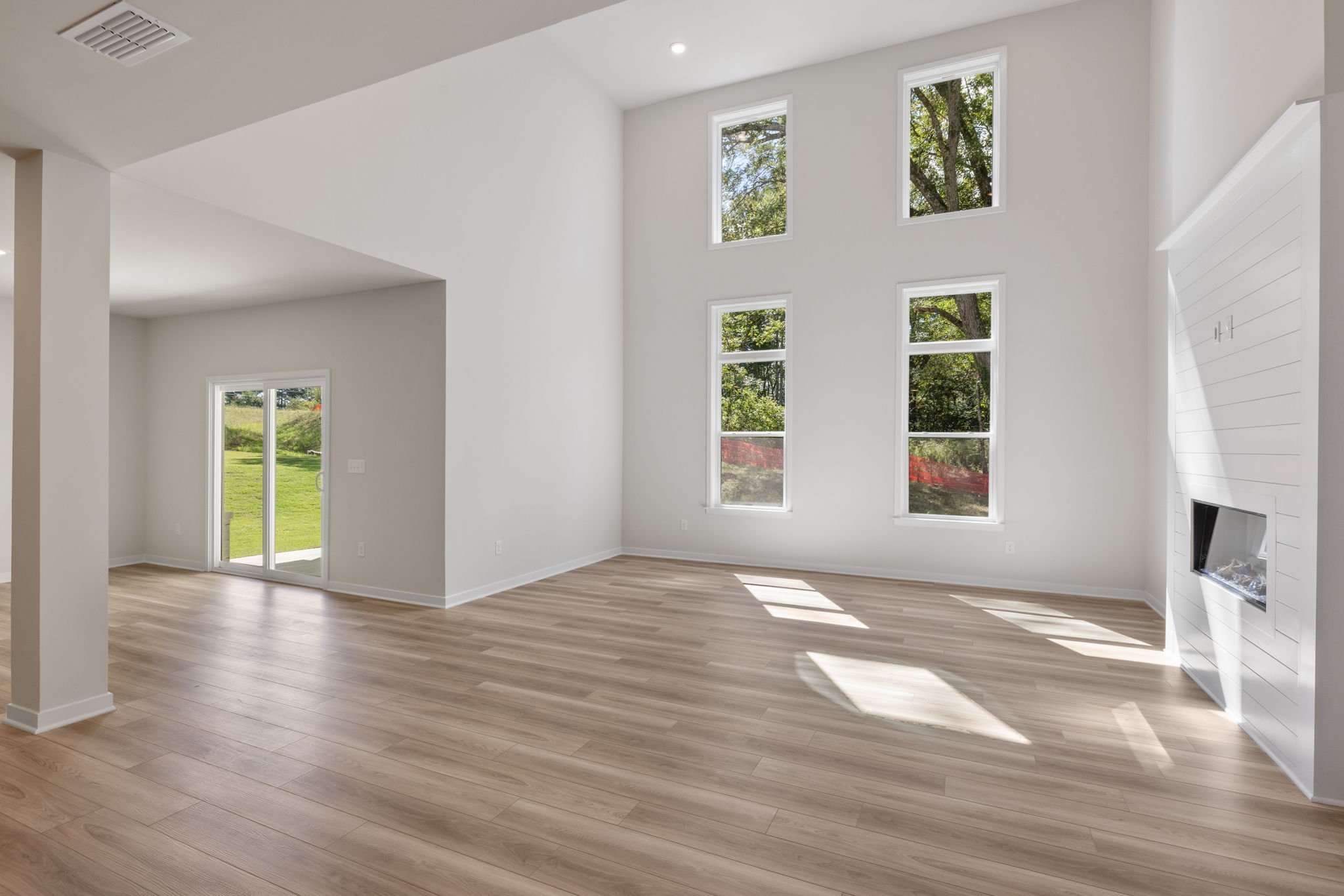 A room with white walls and windows.