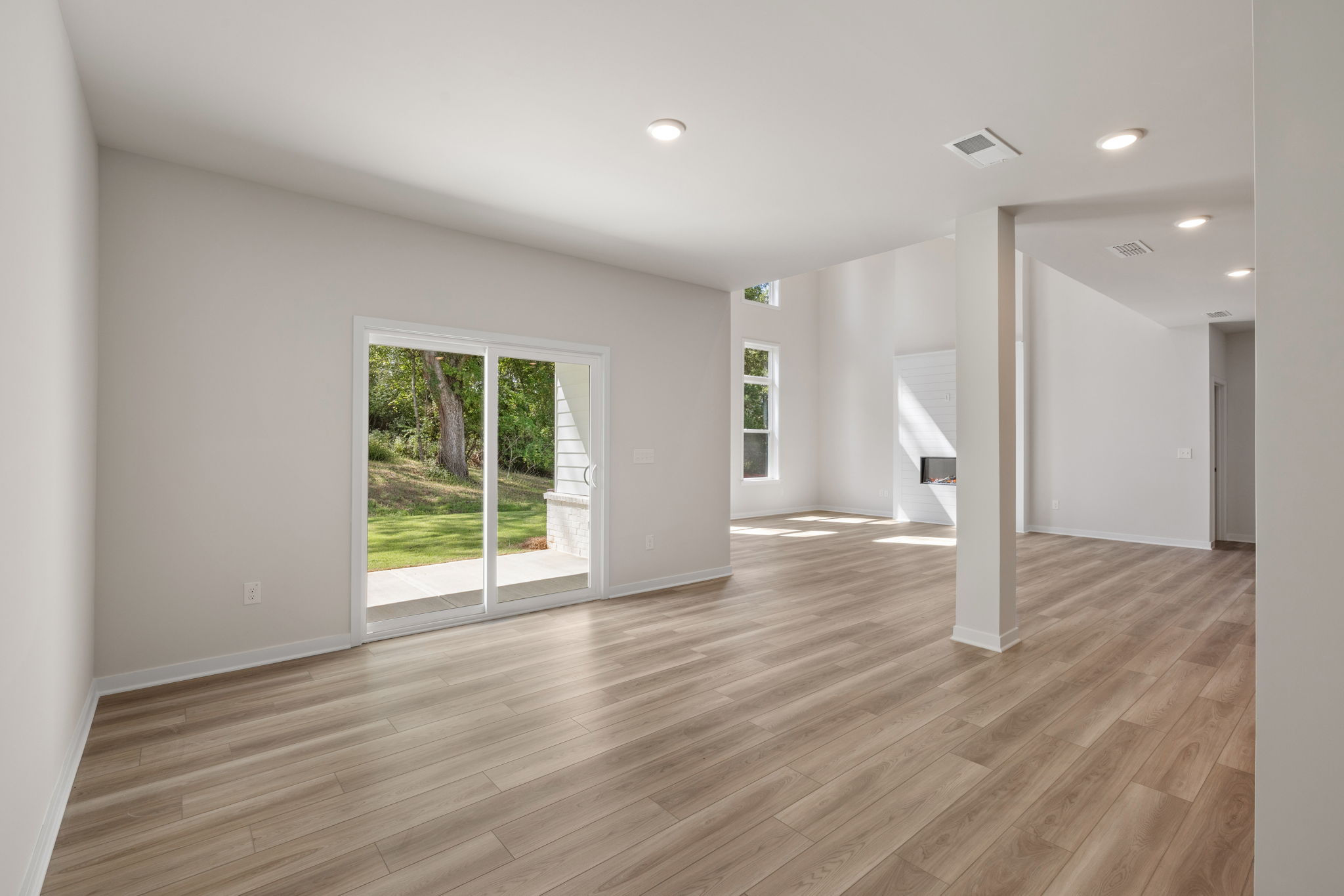 A room with a wood floor and a wood floor.