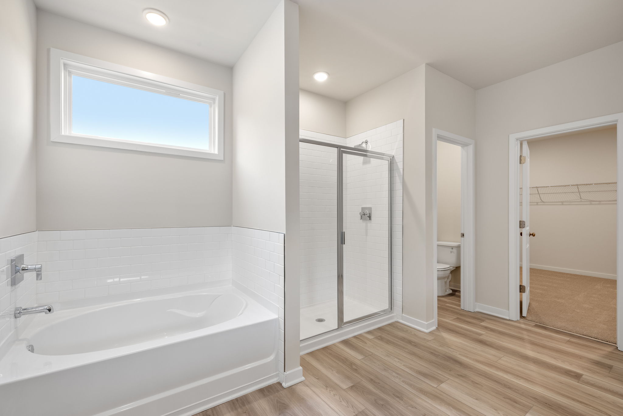 A bathroom with a tub and shower.
