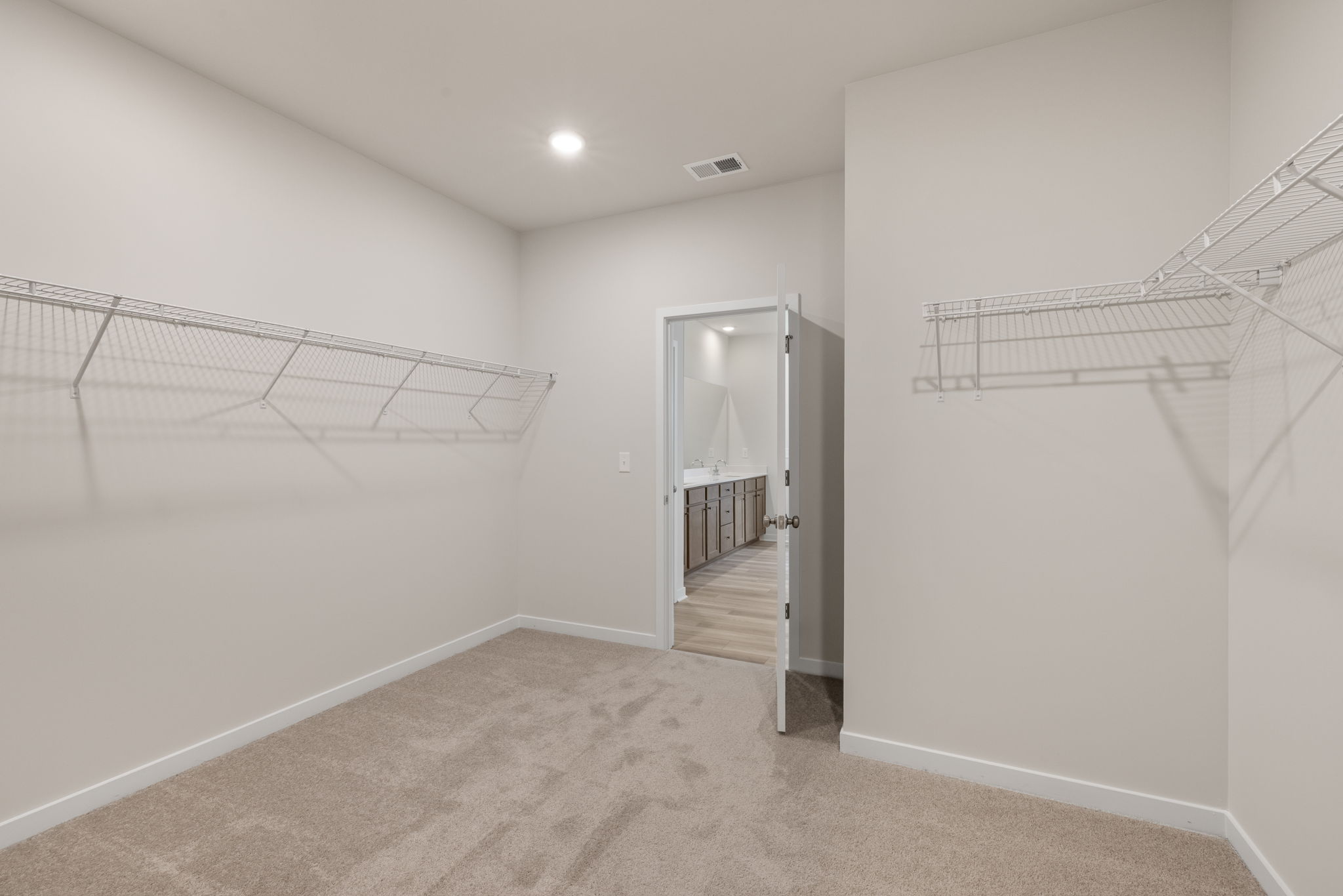 A hallway with white walls.