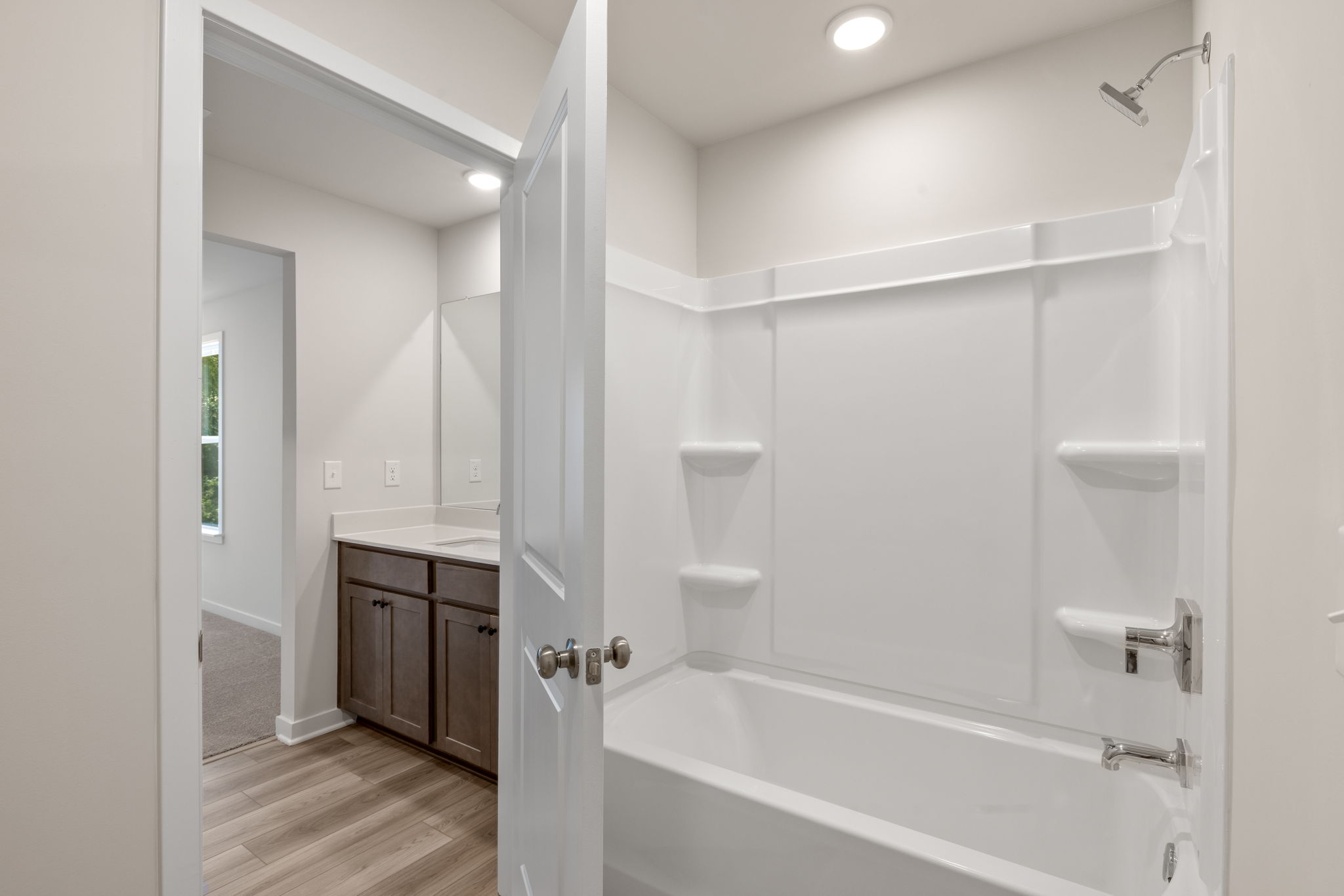 A bathroom with a tub and sink.