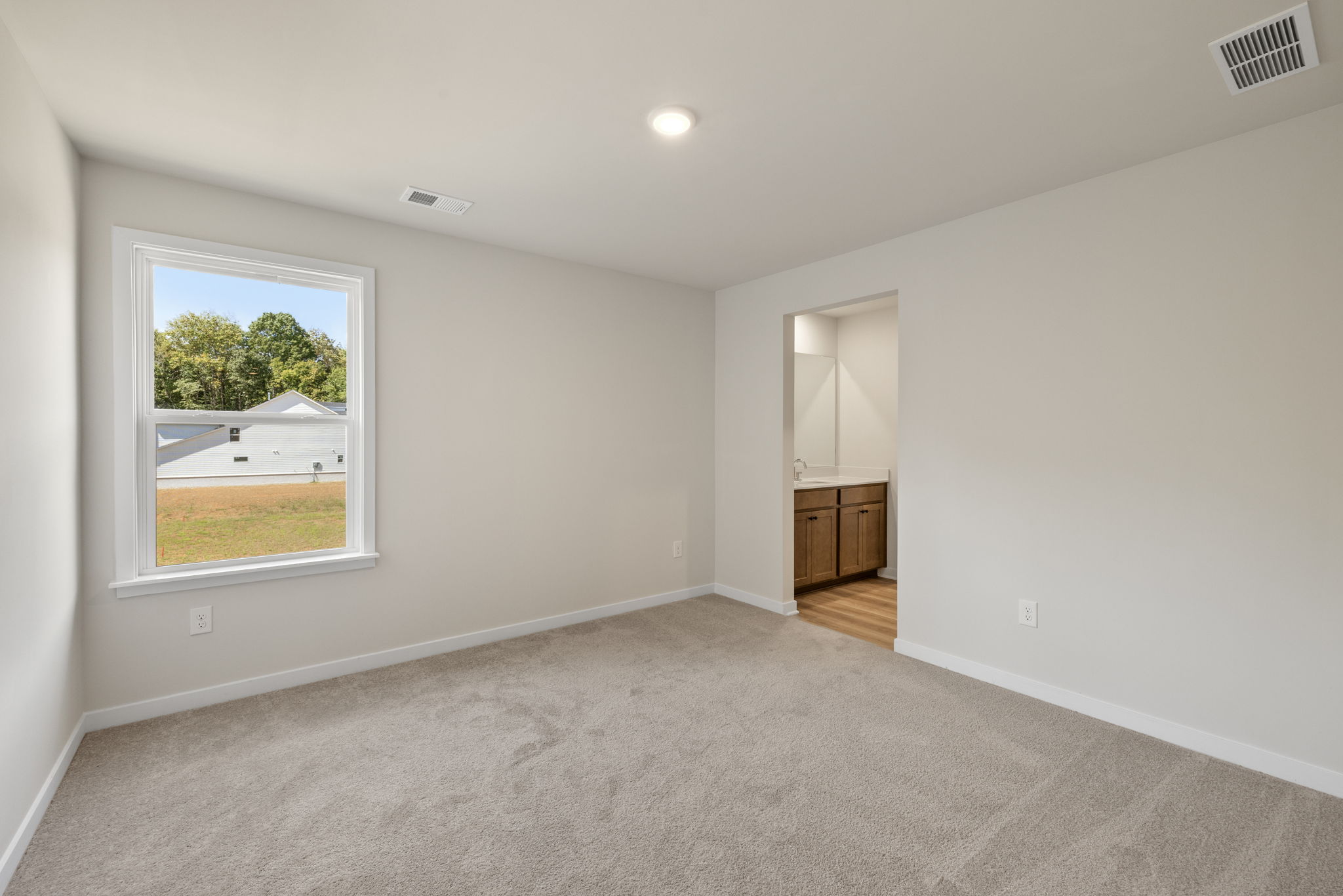 A room with a window and a door.