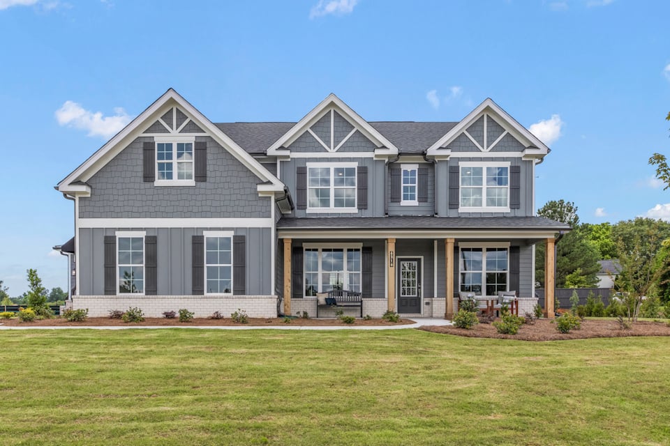 A house with a lawn in front.