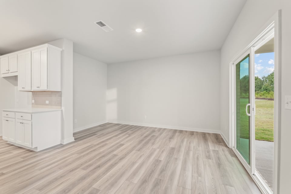 A room with white cabinets.