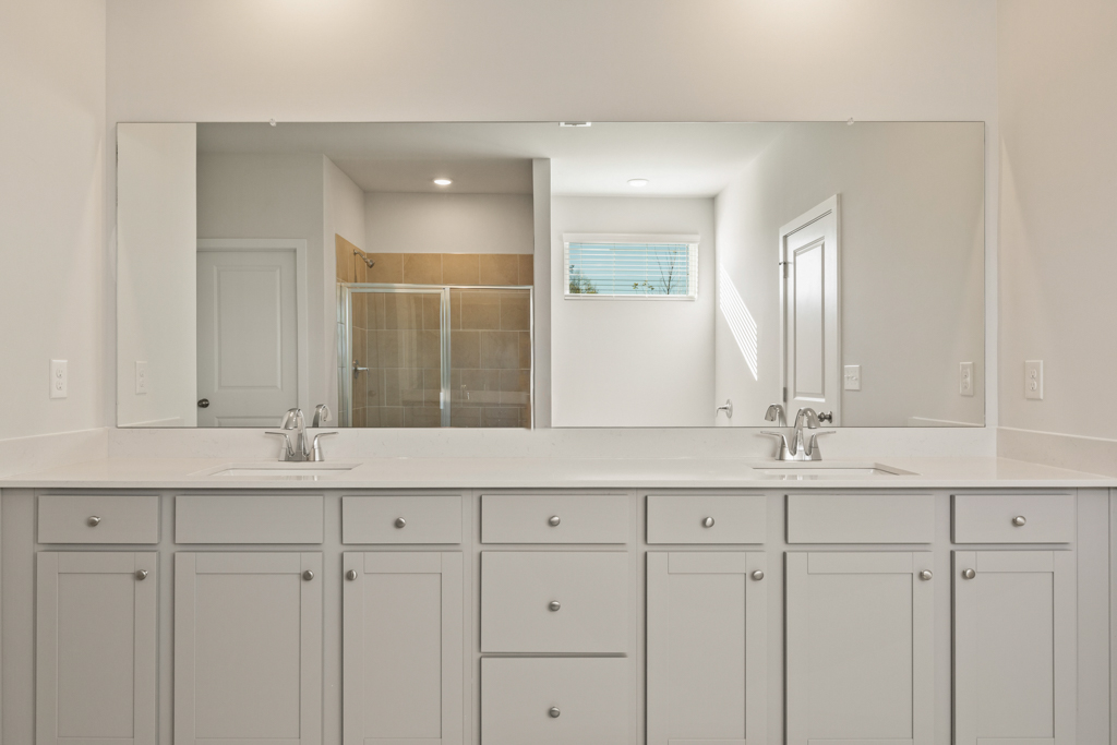 A white kitchen with white cabinets.