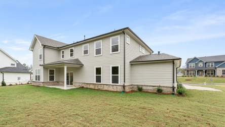A house with a grass yard.