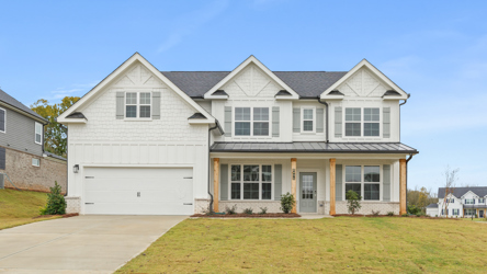 A white house with a garage.