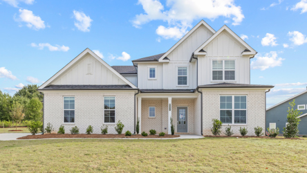 A house with a lawn in front.