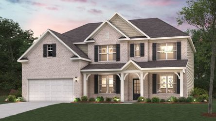 A large house with a lawn in front of it.