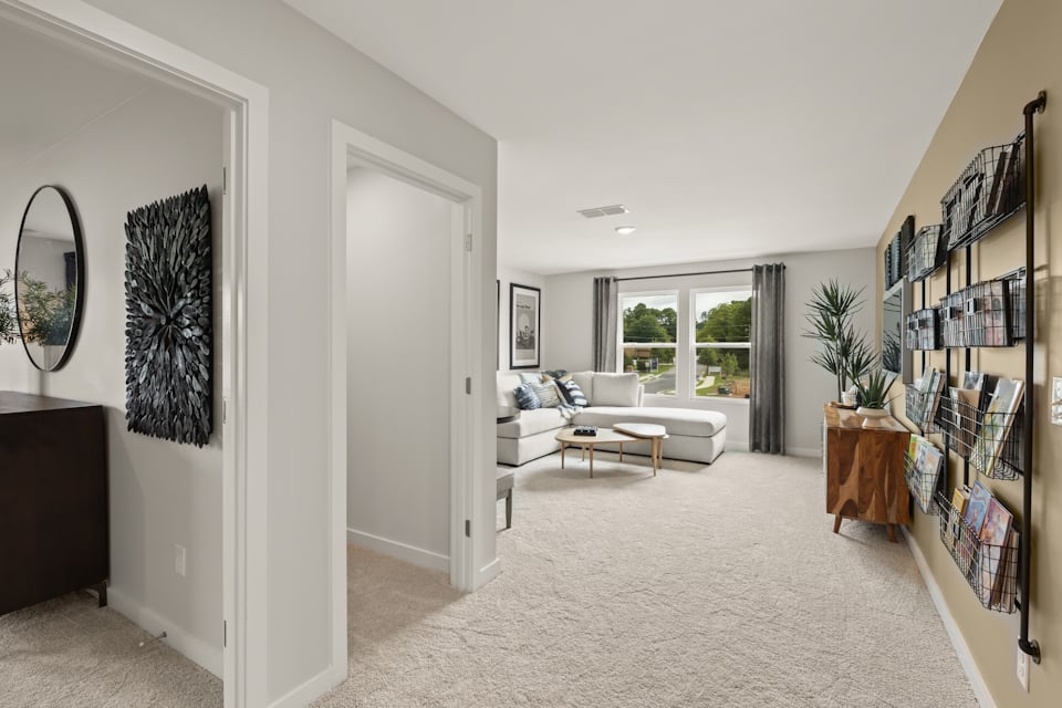A living room with a large mirror.